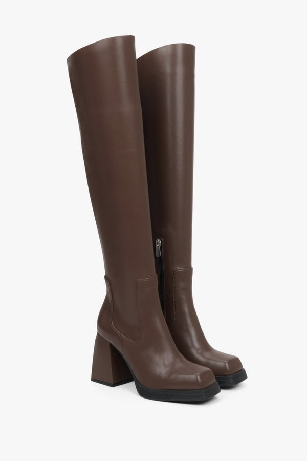 Elegant saddle brown women's boots genuine leather - presentation of a shoe toe and sideline.