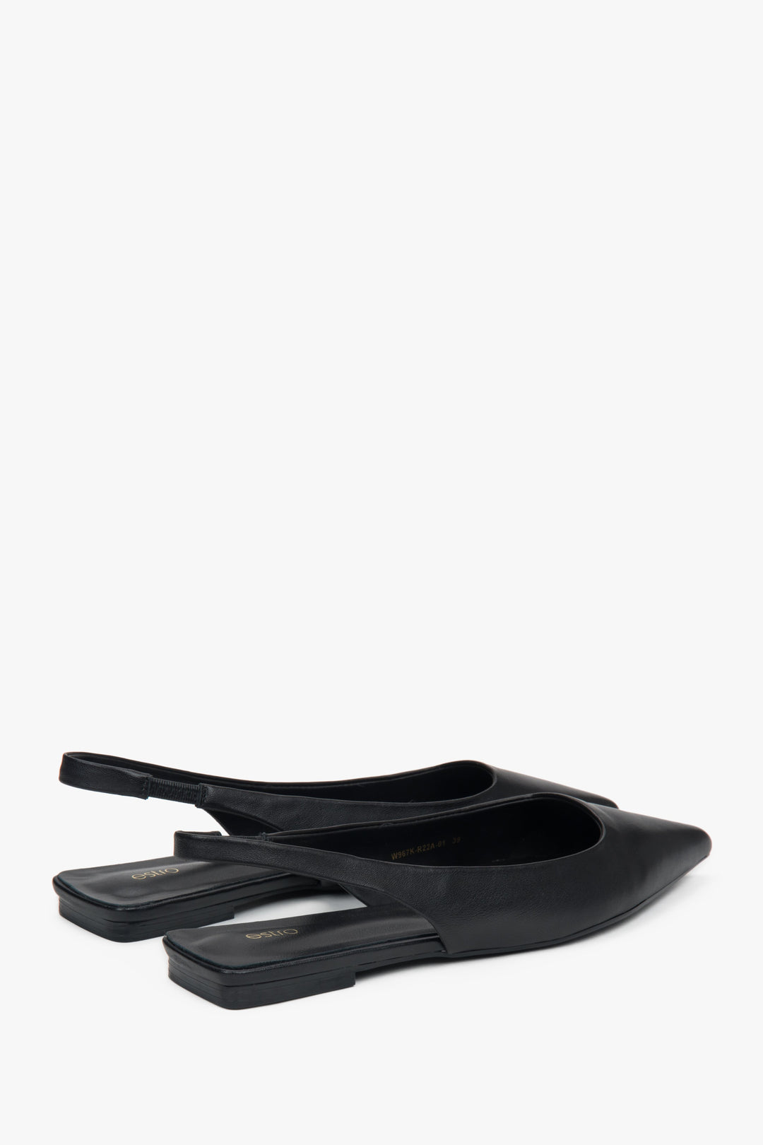 Black slingback sandals with a pointed toe and flat heel.