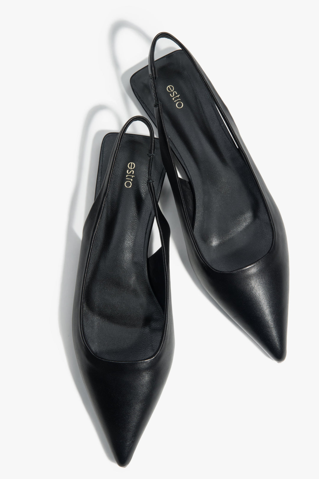 Black slingback sandals with a pointed toe and flat heel.
