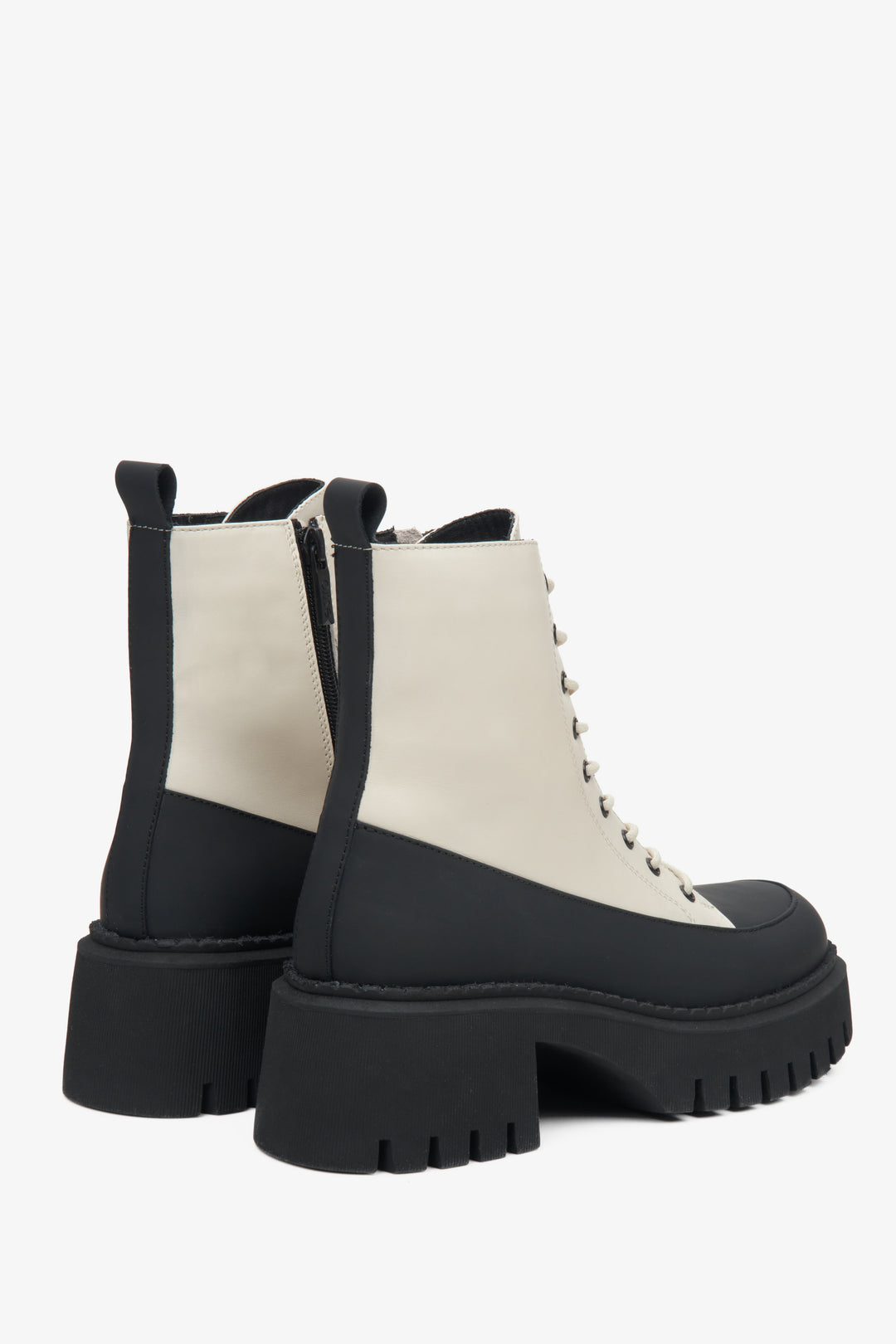 Women's beige and black ankle boots made of genuine leather by Estro - close-up of the back of the model.