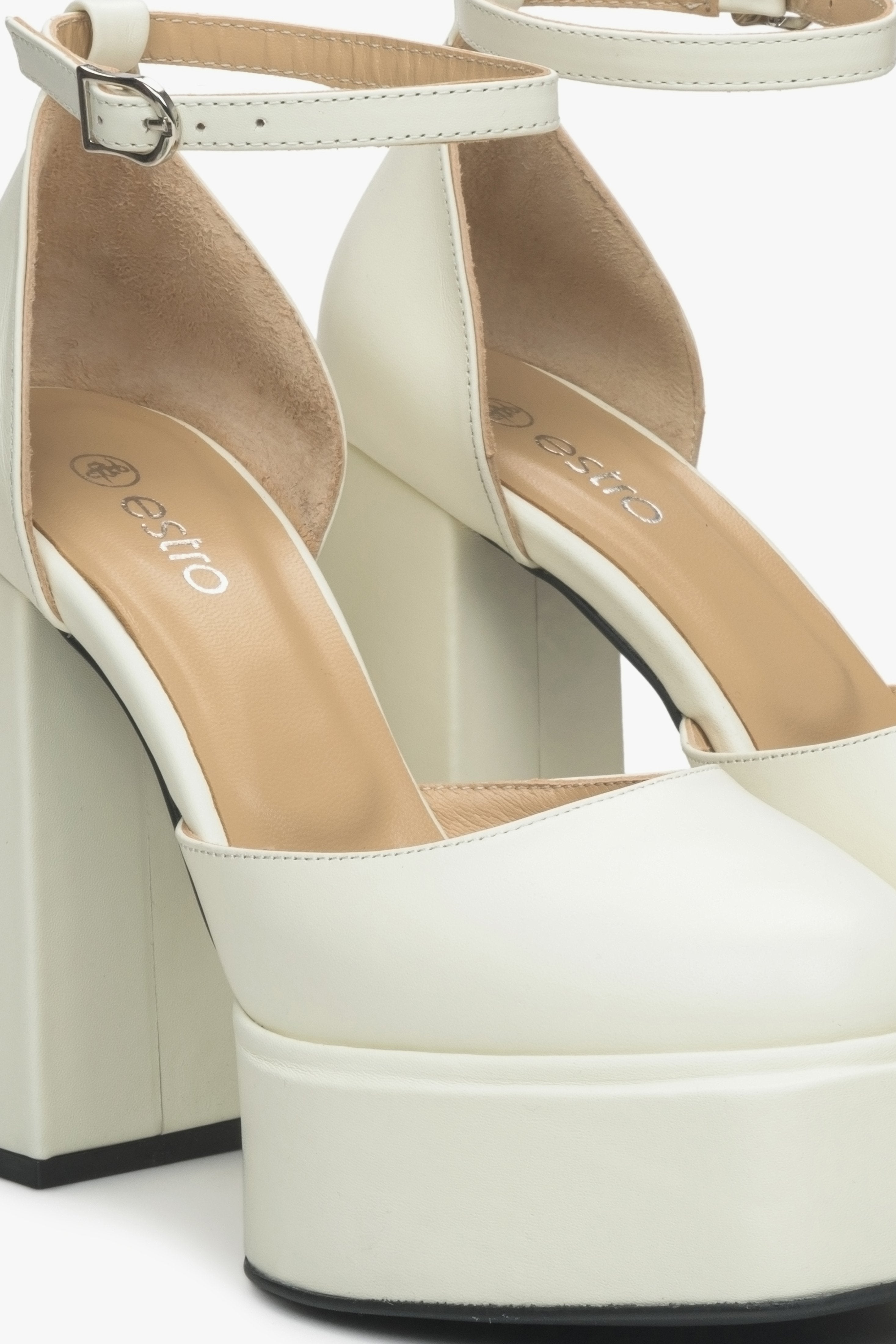 Women's light beige leather heeled sandals.