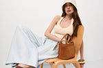 Brown women's handbag by Estro, in a satchel style, crafted from Italian natural velour and leather.