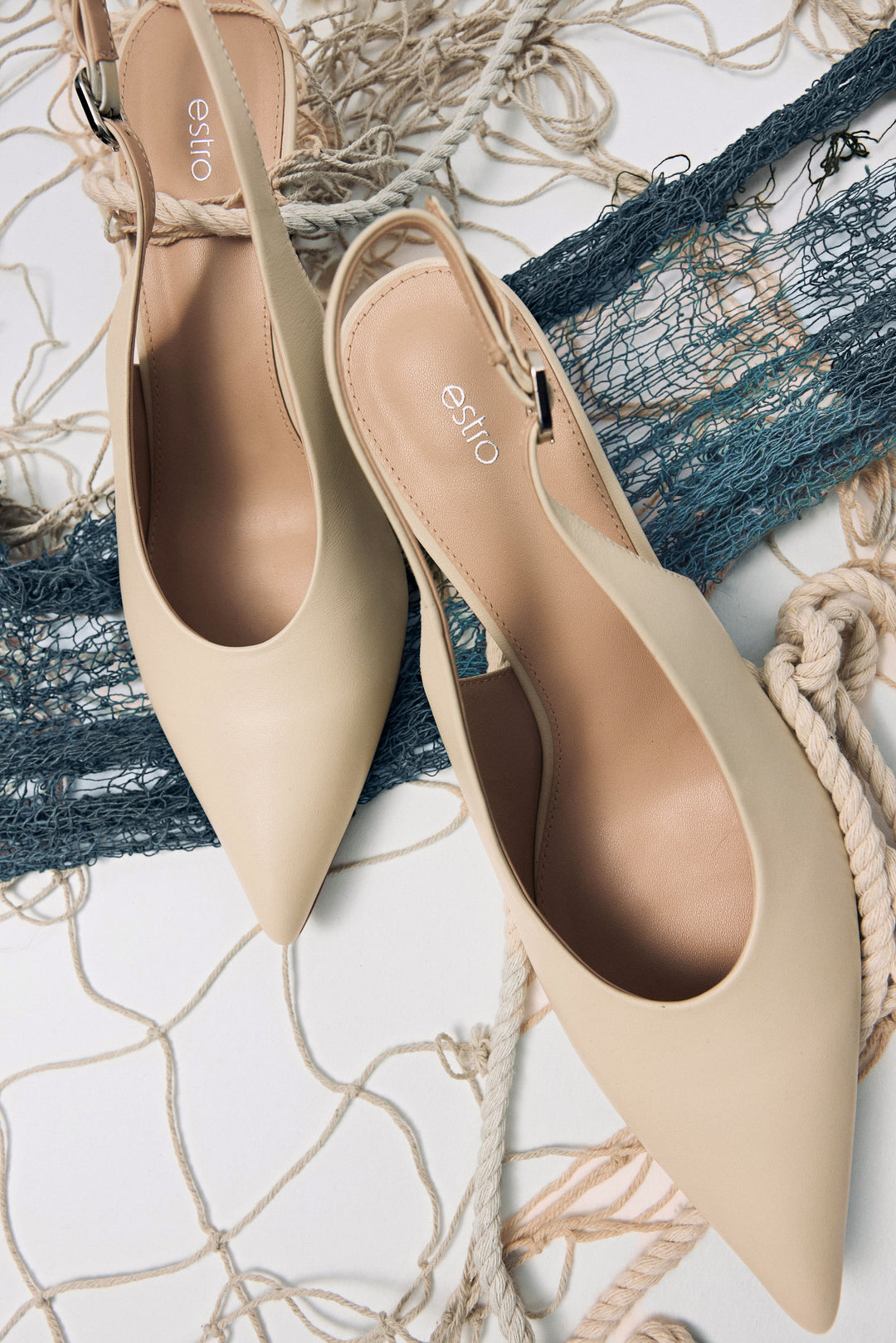 Stylish women's slingback pumps by Estro in light beige, crafted from leather and set on a low heel.