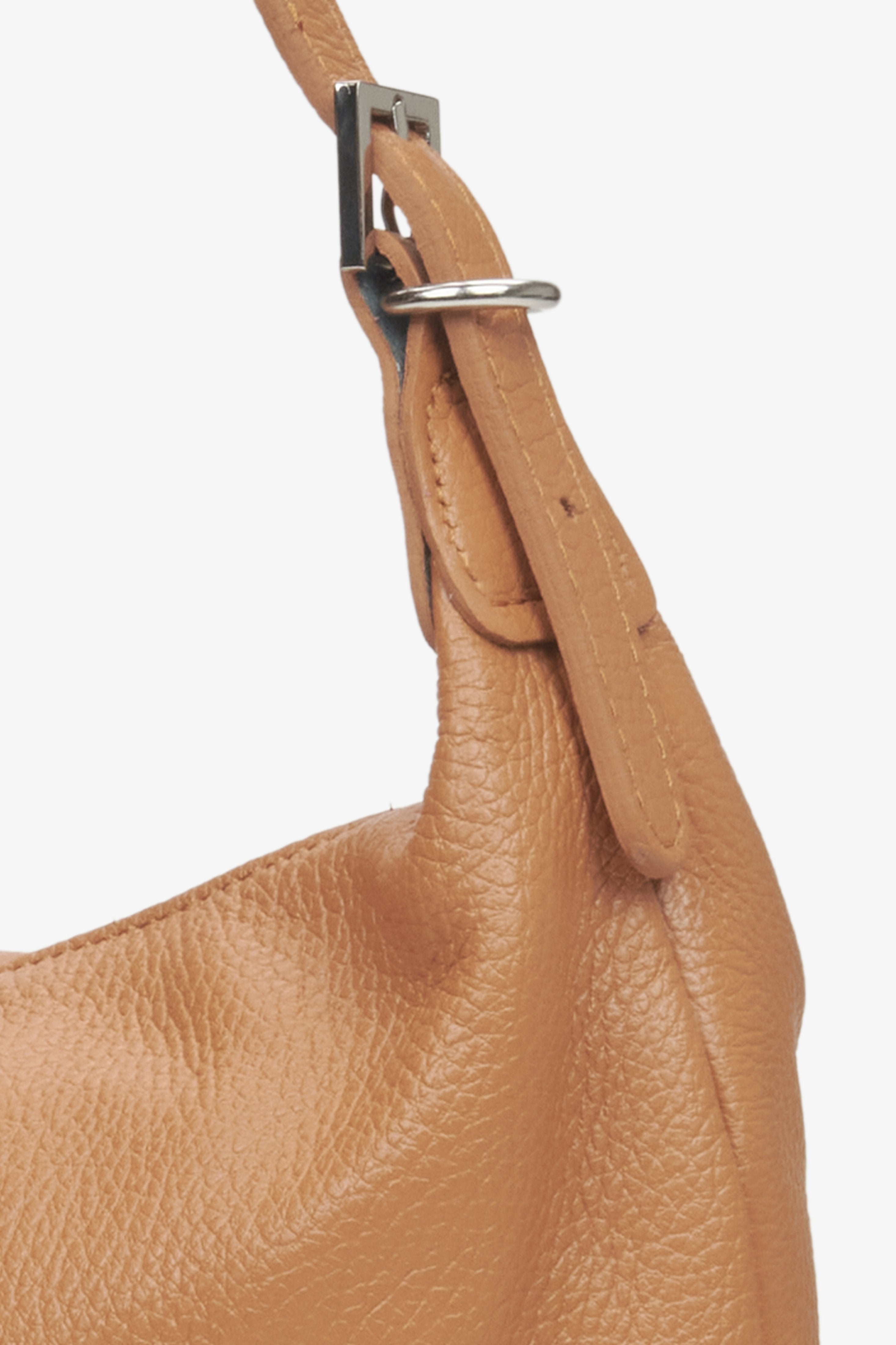 Brown spacious bag made of Italian genuine leather - close-up on details.