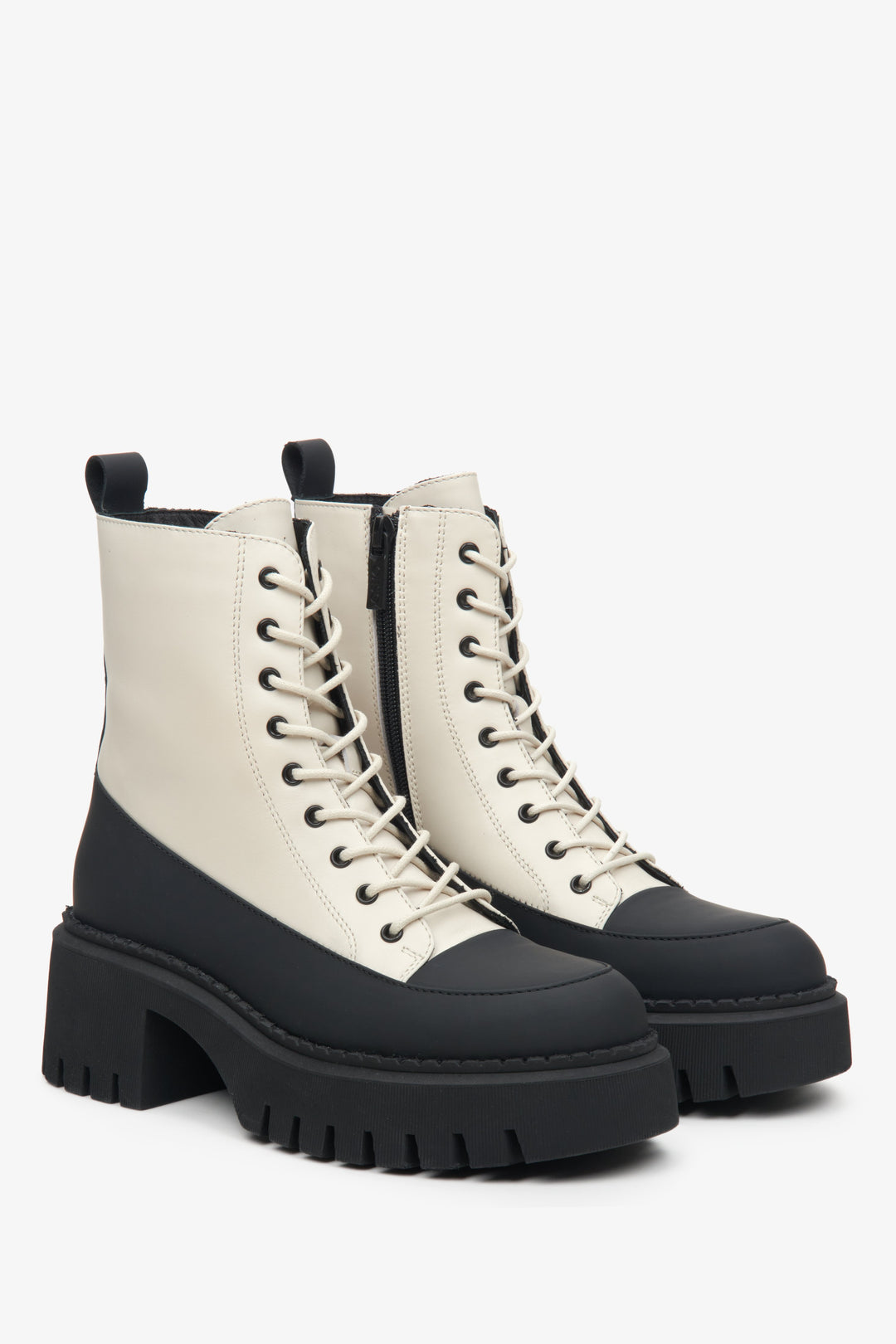 Women's leather beige and black ankle boots with decorative lacing by Estro.