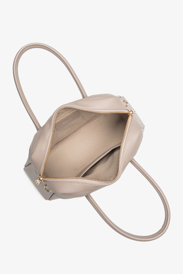 Stylish beige women's handbag by Estro, crafted from genuine leather, featuring a classic boxy shape – interior view of the model.