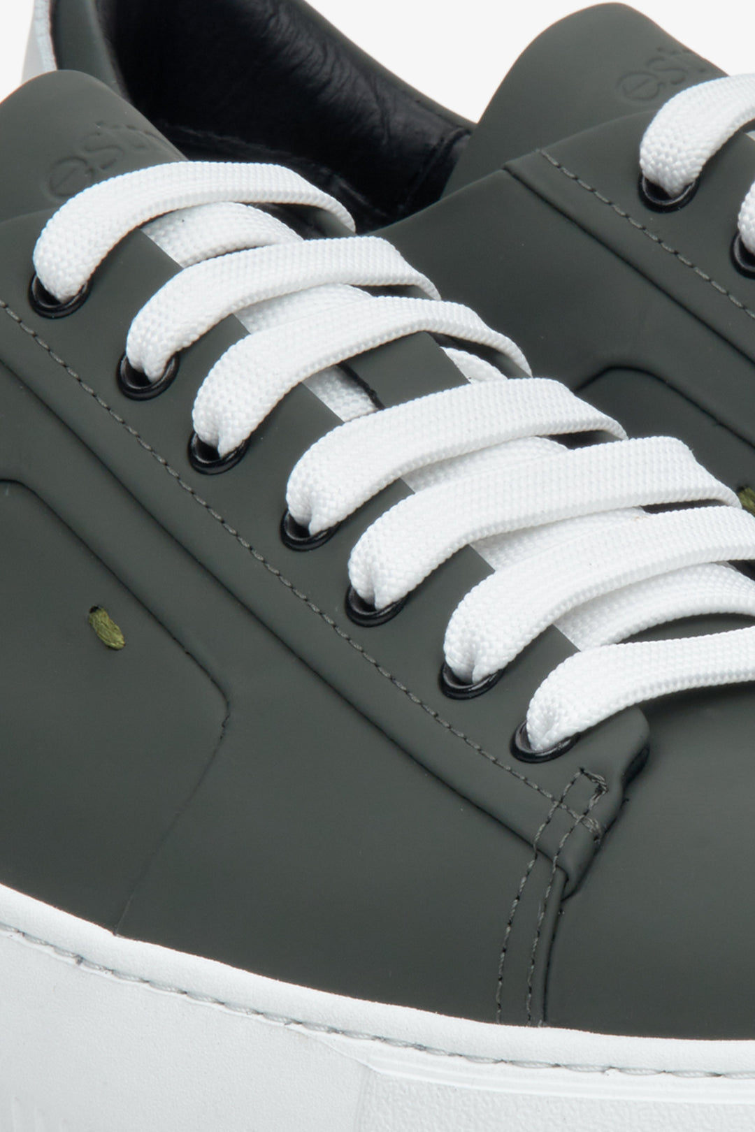 Men's green sneakers by Estro made of genuine leather - close-up on details.