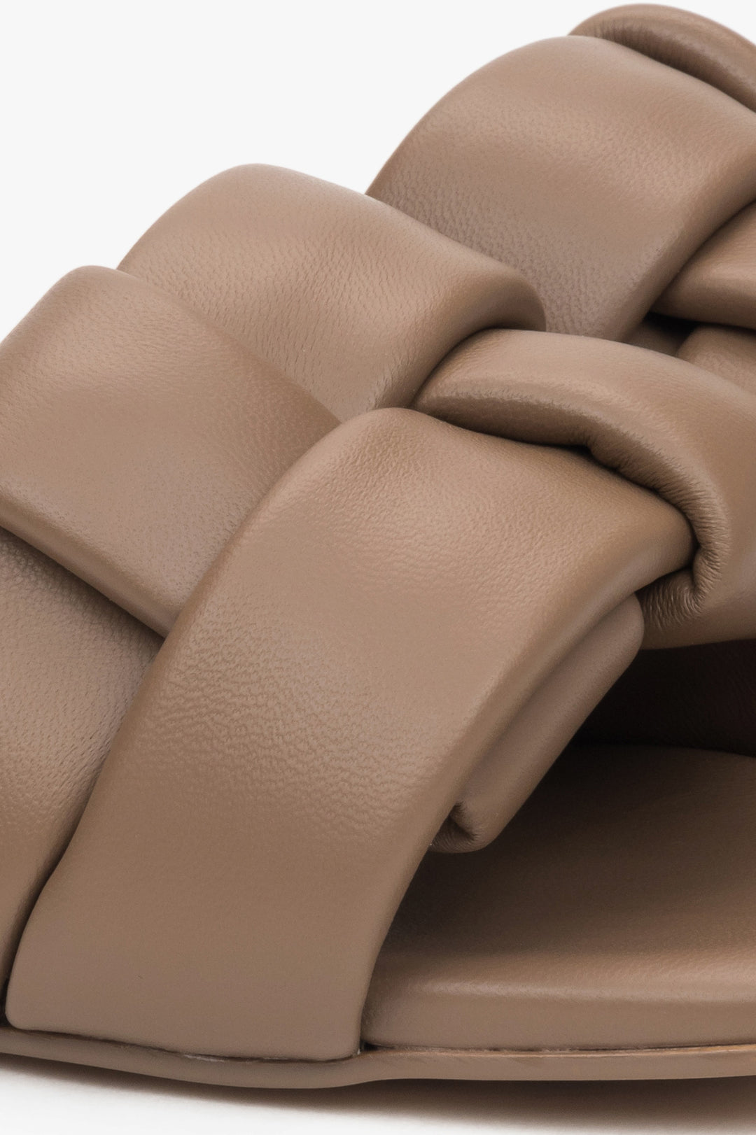 Women's light brown slides made of genuine leather by Estro - close-up on detail.