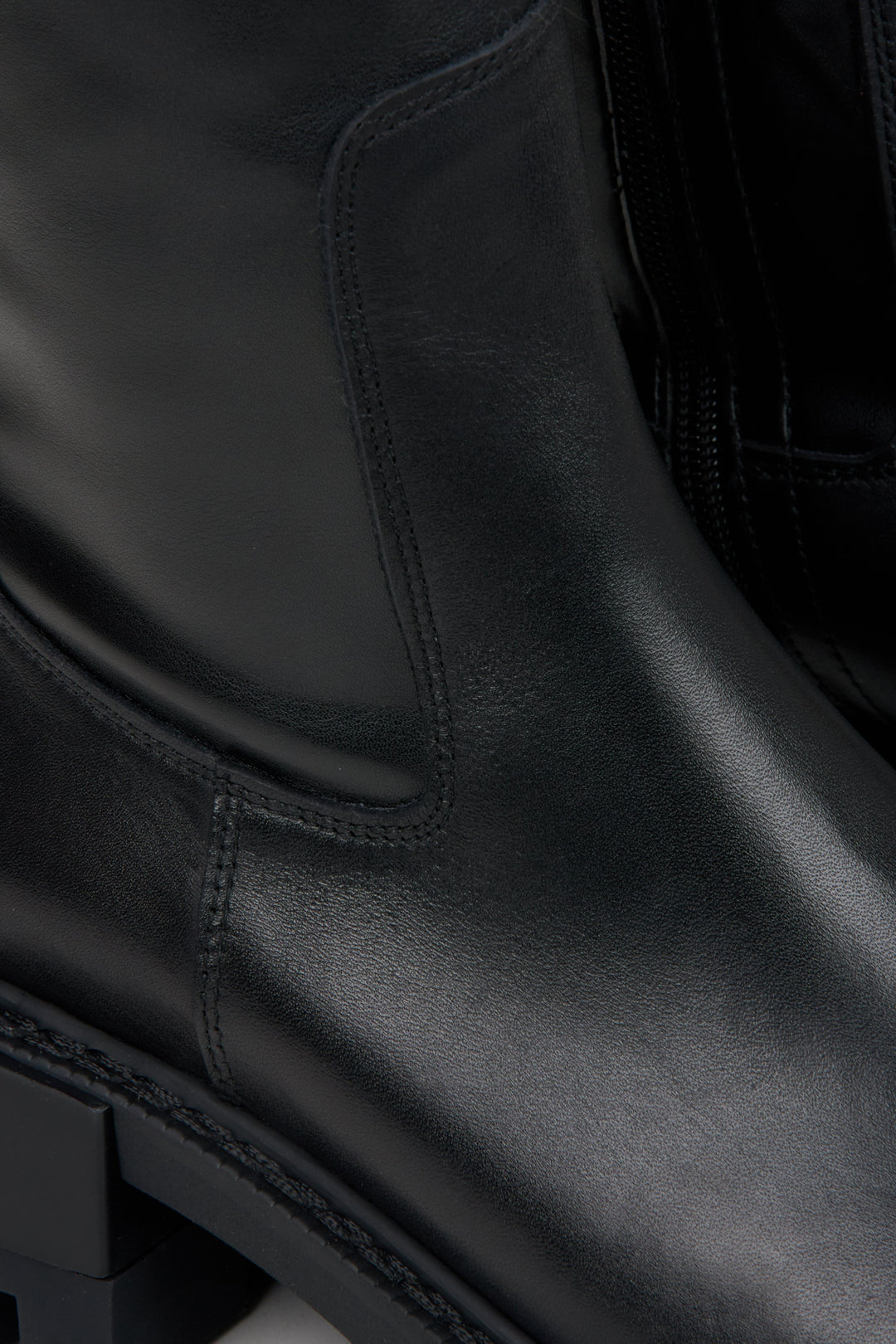 Women's black leather boots by Estro - close-up on details.