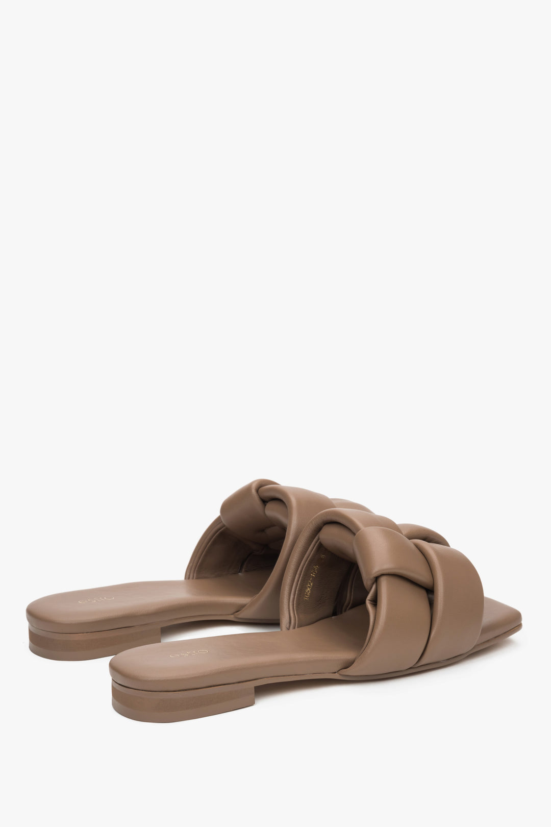 Women's light brown leather slides by Estro with a flat heel.