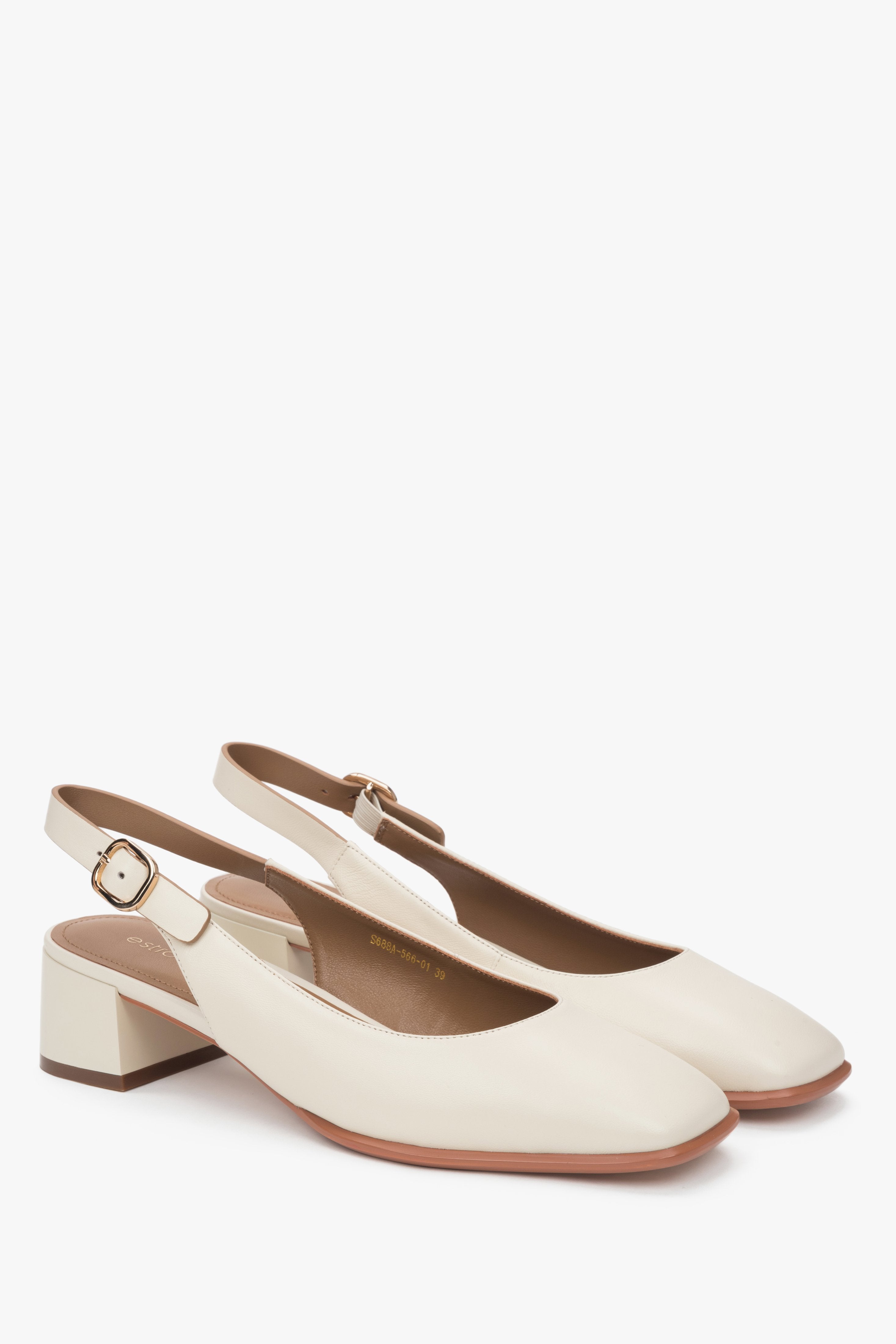Elegant light beige Estro women's pumps, with a classic slingback design, on a comfortable low heel.
