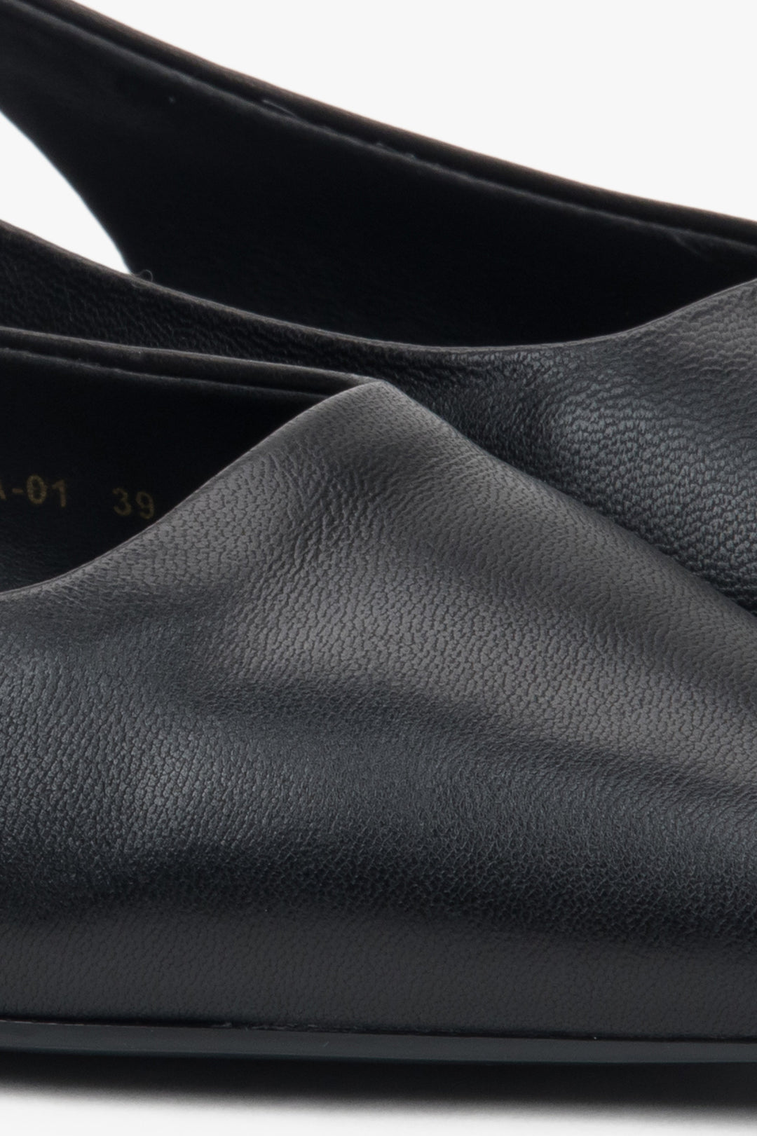 Stylish women's slingback sandals with black detailing and a pointed toe.