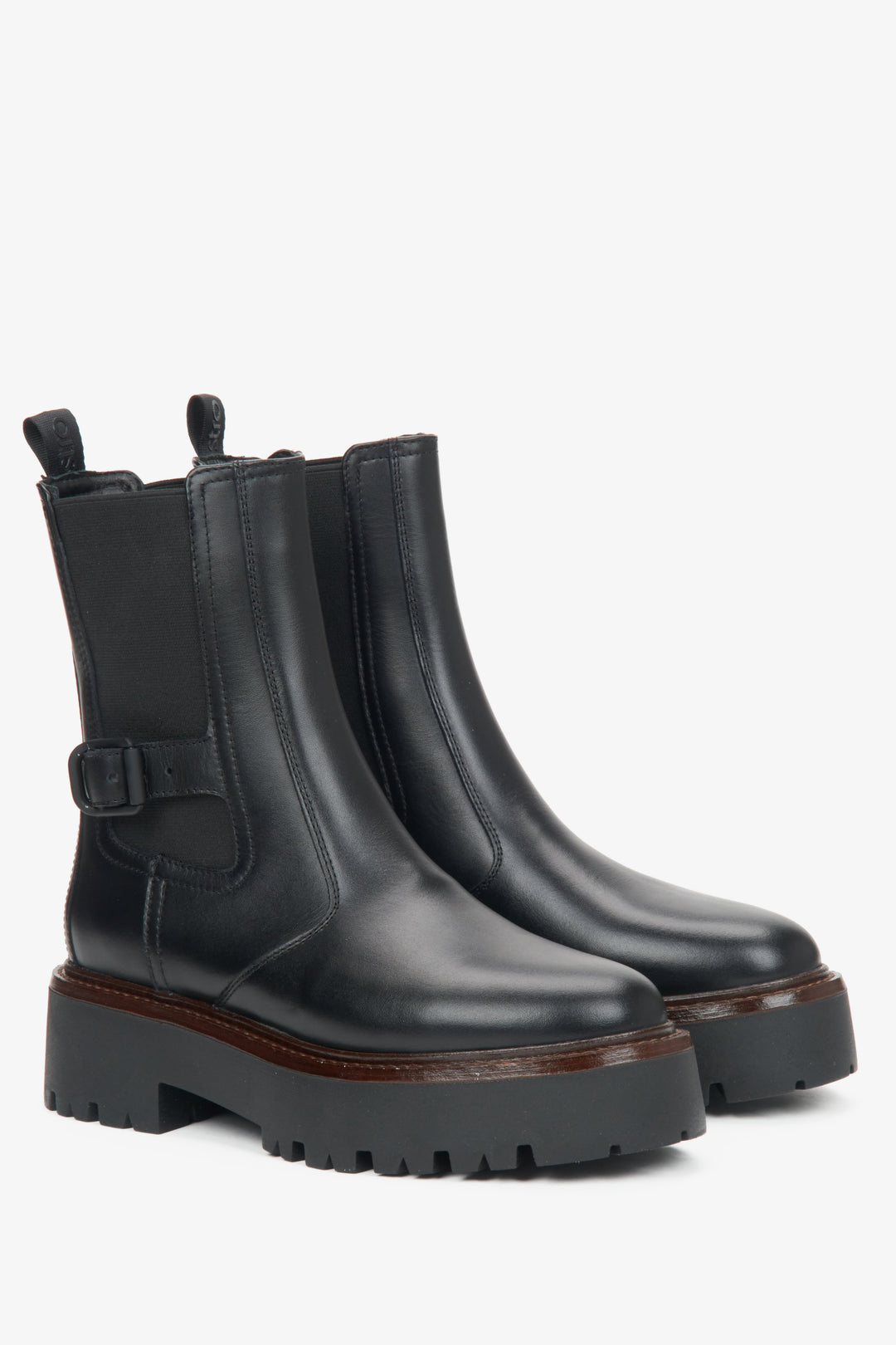 Women's black leather ankle boots with a decorative buckle by Estro.