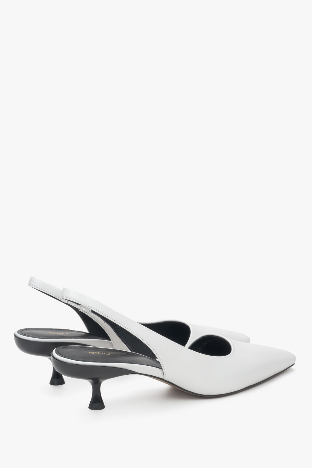 White slingback pumps with a low heel, made of genuine leather by Estro.