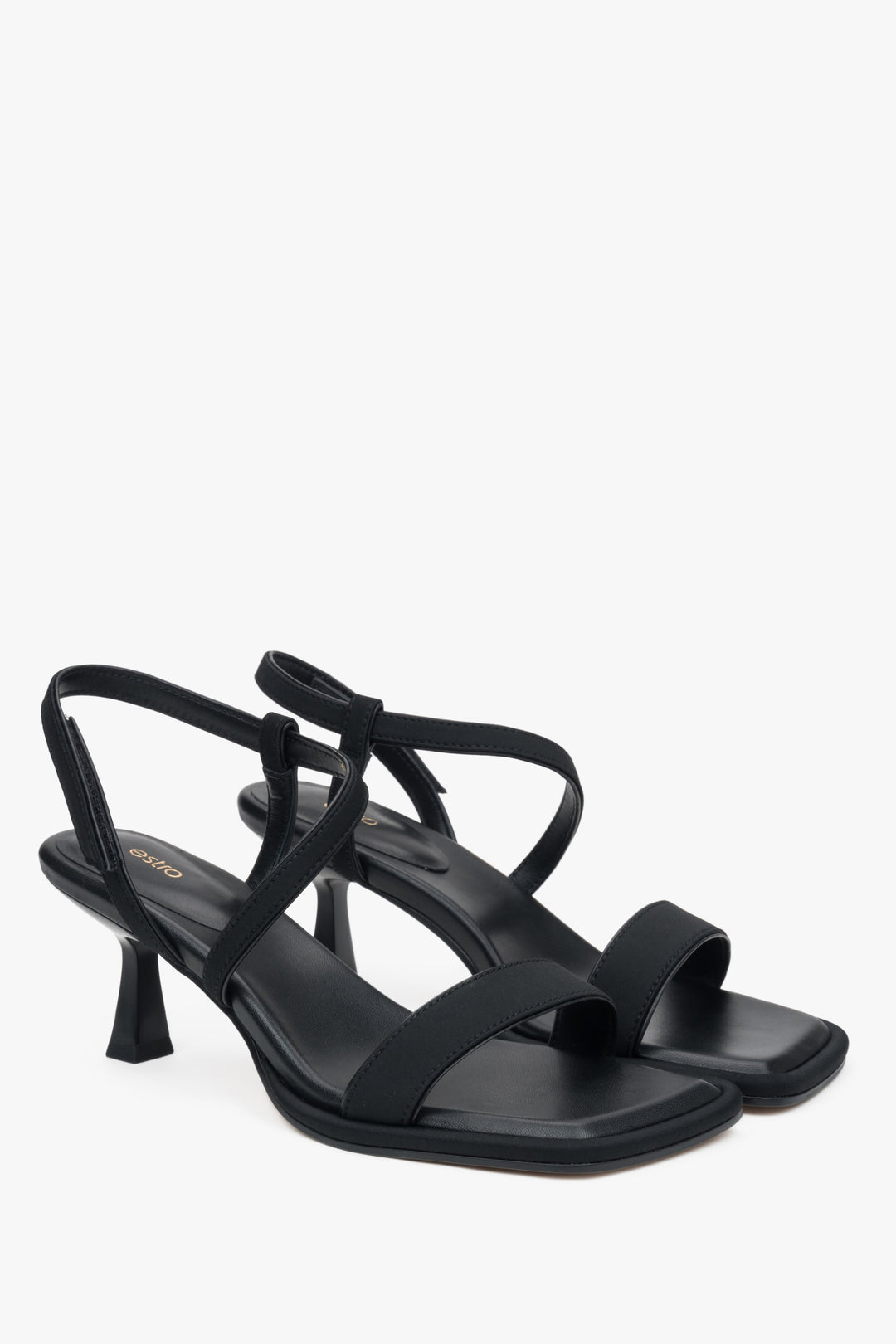 Elegant black Estro women's sandals, combining genuine leather and textiles, set on a stylish heel.