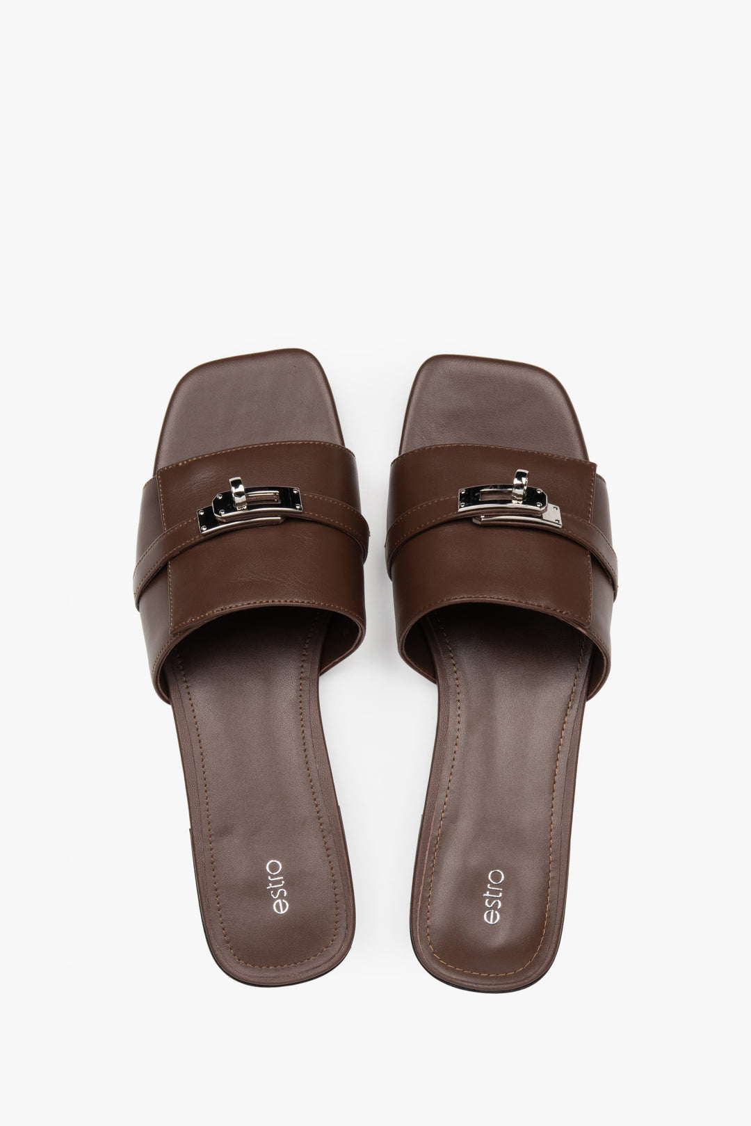 Classic dark brown Estro women's slide sandals, refreshingly accented with a silver embellishment — perfect for summer and comfortable thanks to the flat sole.