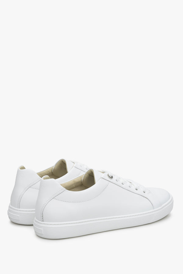 Women's lace-up white sneakers by Estro - close-up on the side seam and heel.