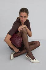 Elegant light beige women's slingback pumps by Estro, crafted from glossy patent genuine leather in a timeless silhouette - – on-foot presentation.