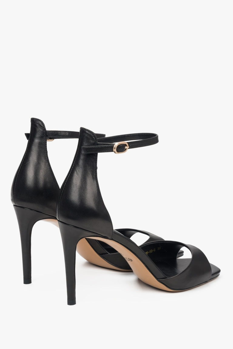 Women's versatile black sandals Estro made of genuine leather and set on a high heel.
