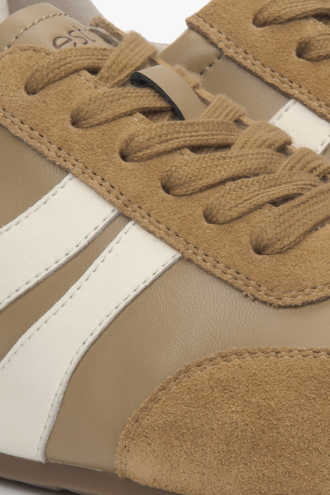 Light women's sneakers from Estro made of natural velour and leather in brown - close-up of details.
