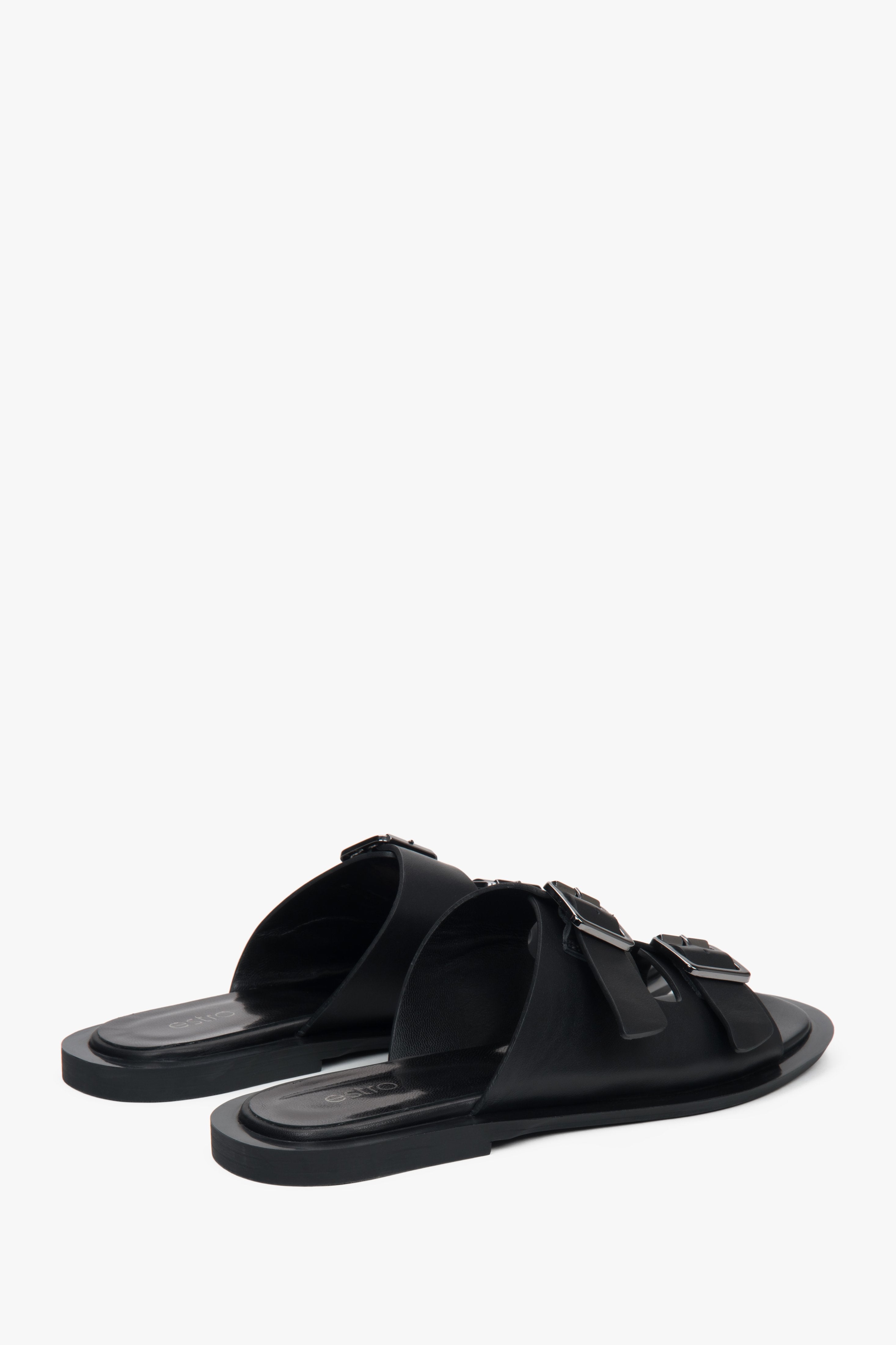Stylish black women's slides by Estro, made of natural leather and featuring two distinctive straps—perfect for everyday wear.