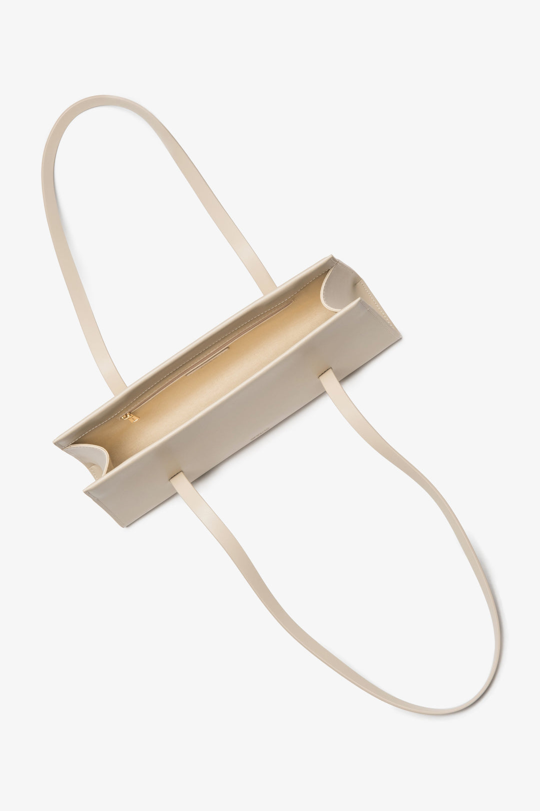 Practical and stylish light beige women's handbag by Estro, made of natural leather and featuring long handles for easy shoulder wear.