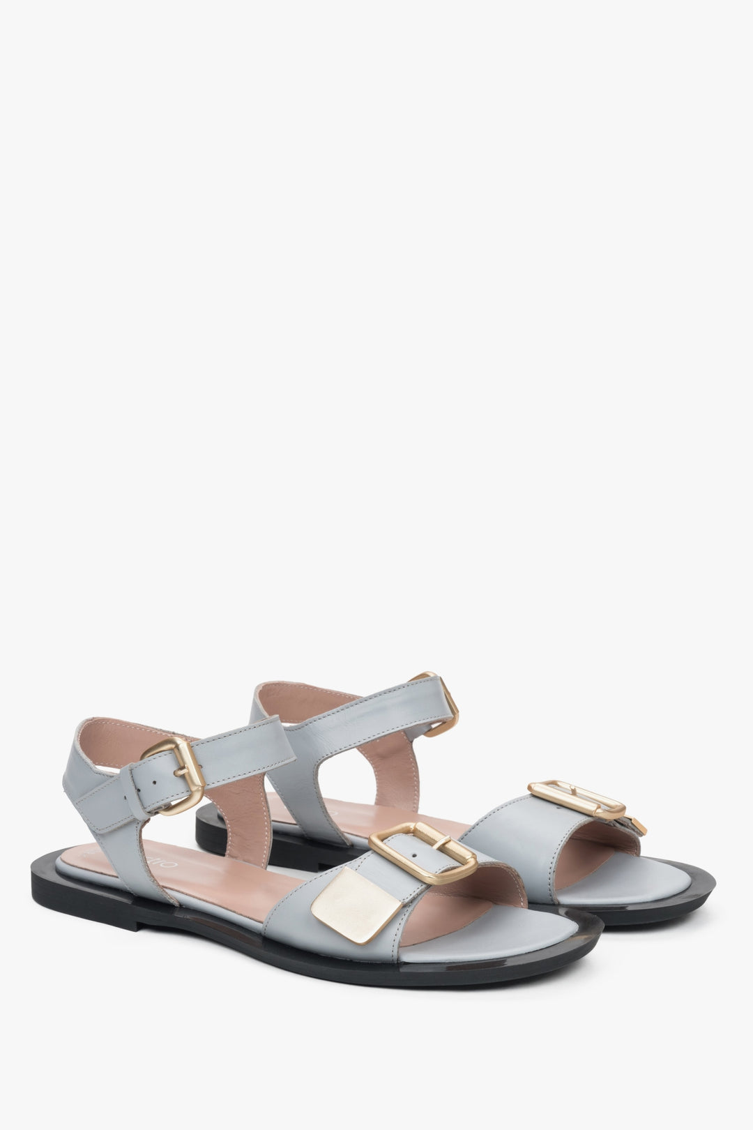 Light blue women's leather sandals by Estro, ensuring comfort, with a flat heel.