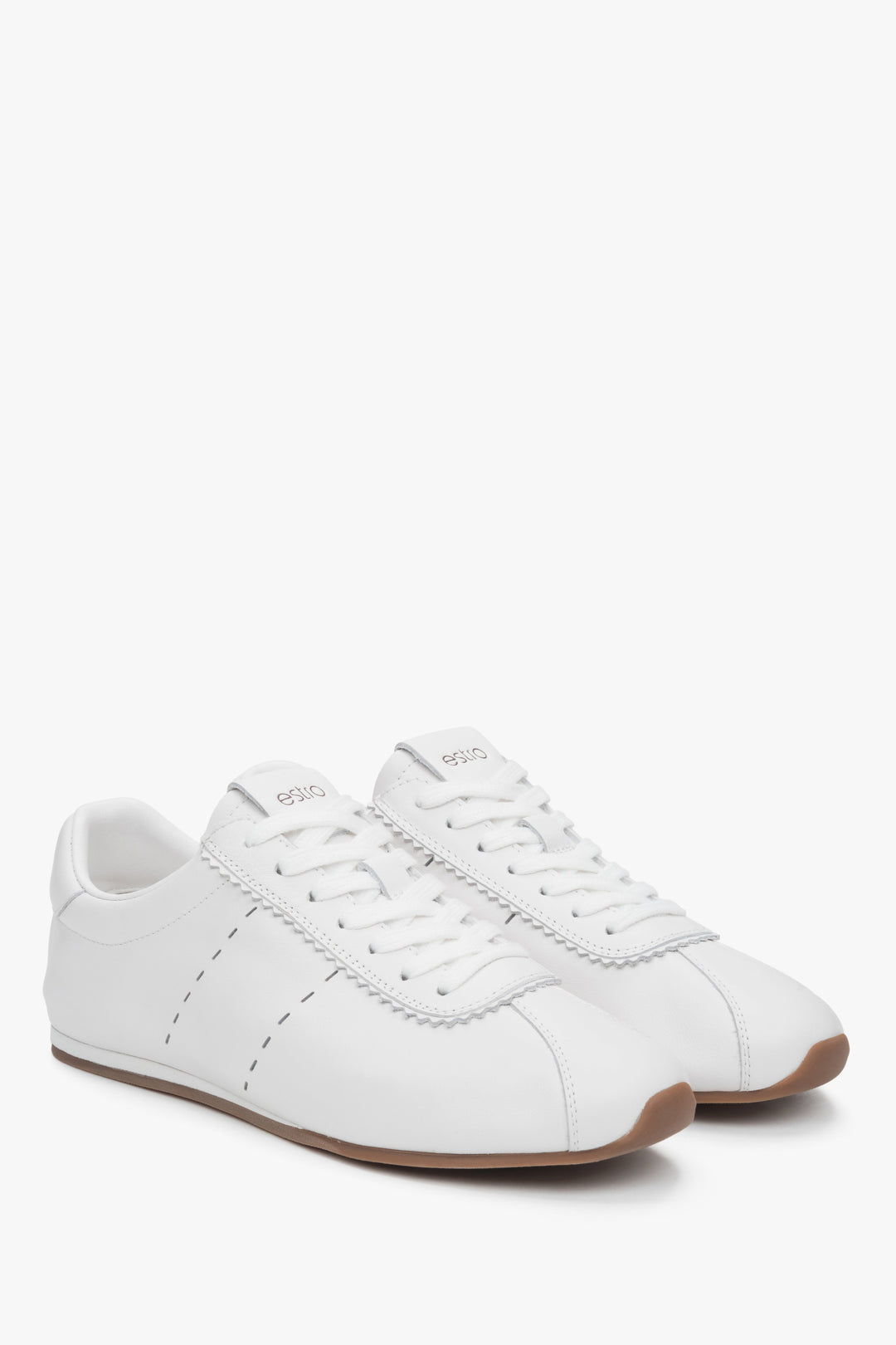 Soft white leather women's sneakers with a low sole by Estro.