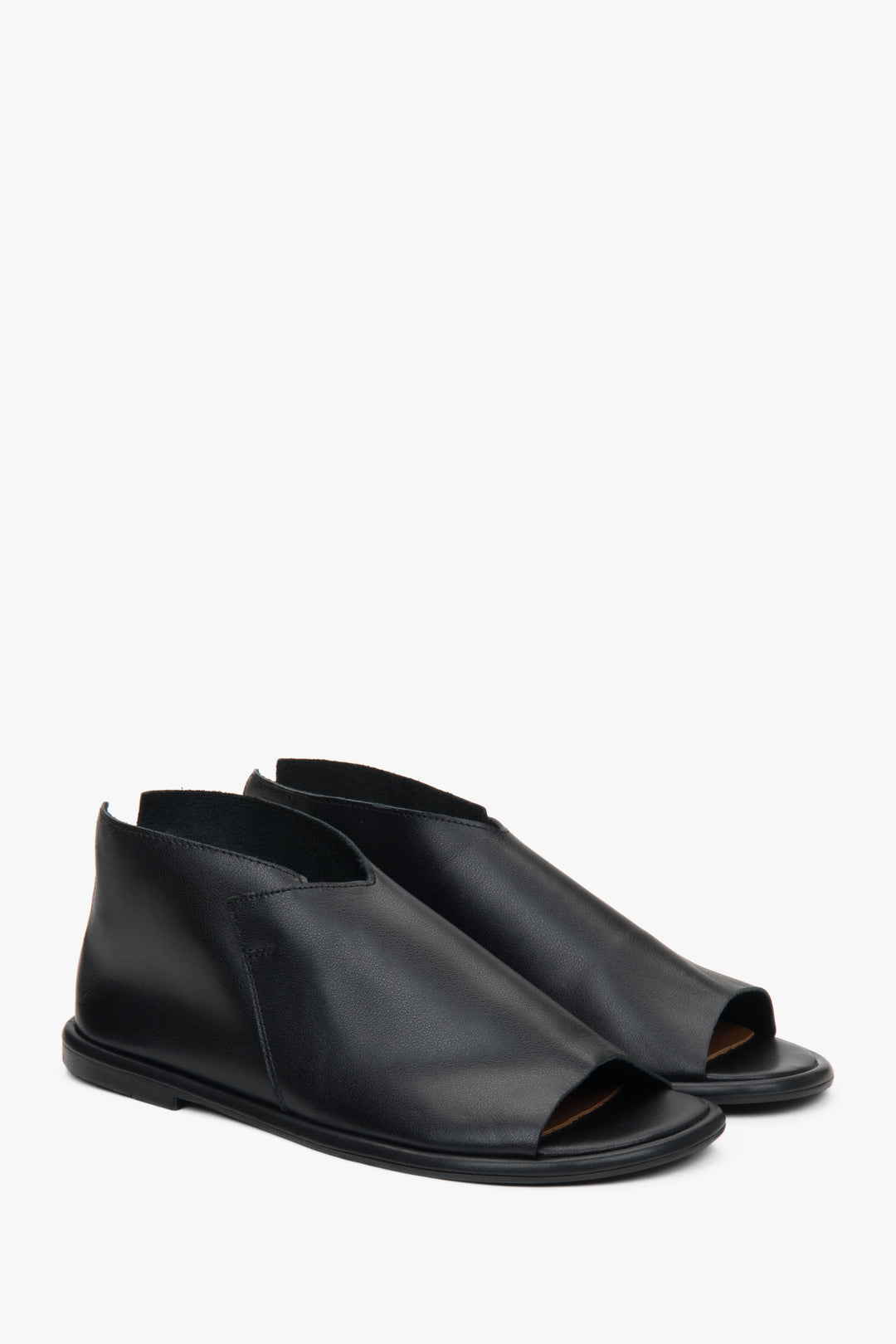 Women's black leather sandals from Estro, featuring a closed-heel design for added support.