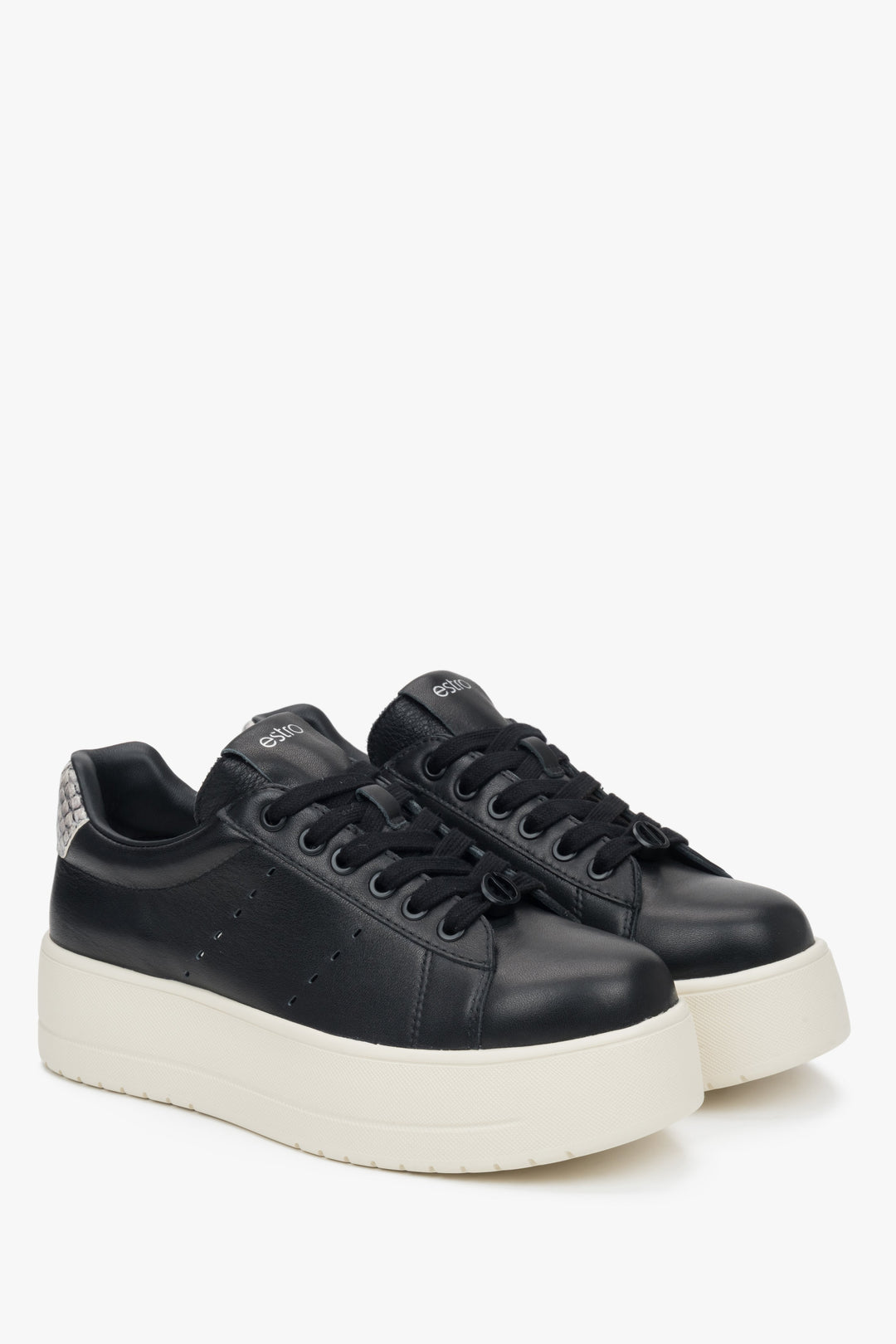 Black leather low-top sneakers with chunky sole.