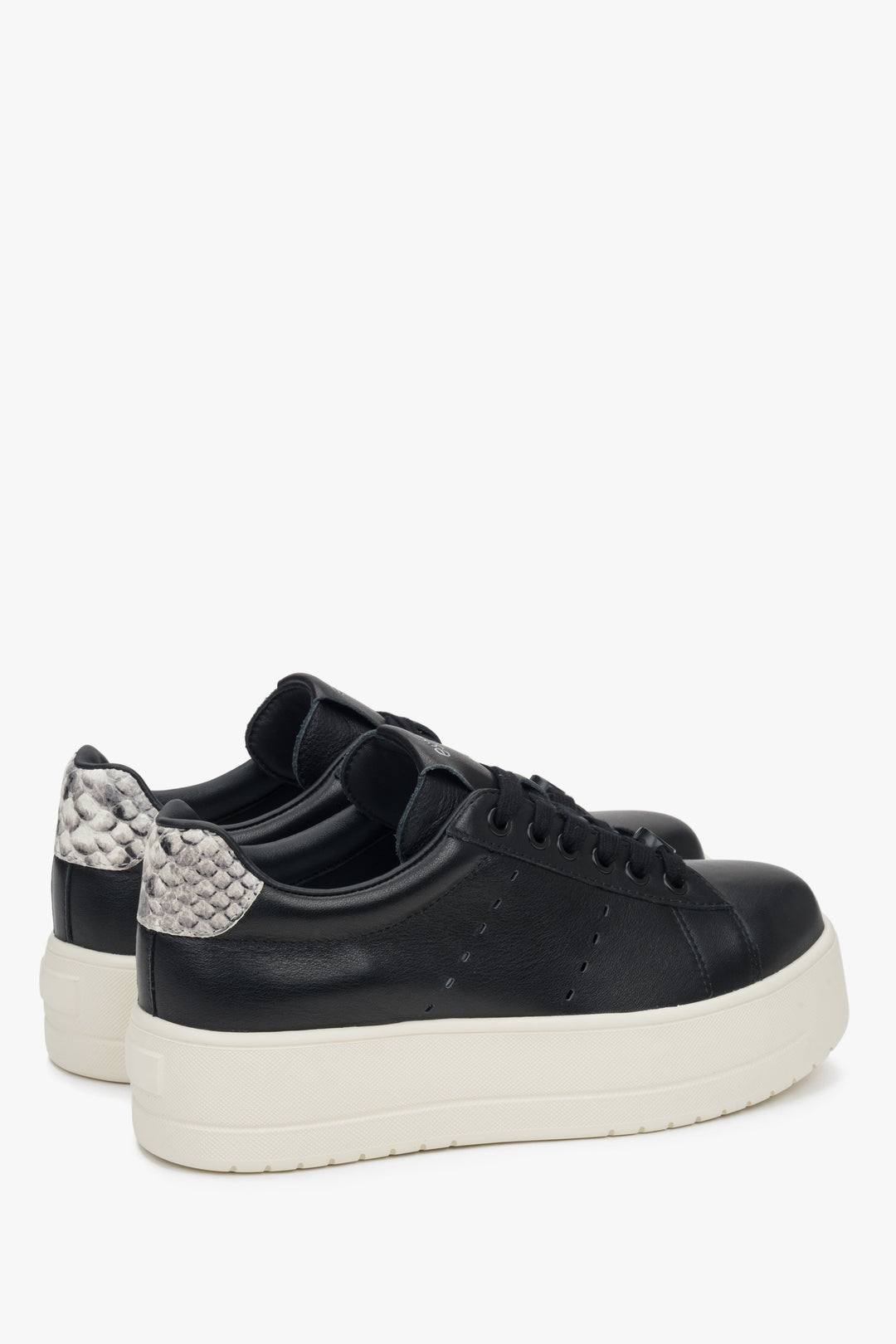 Women's low-top sneakers in black leather with chunky sole.