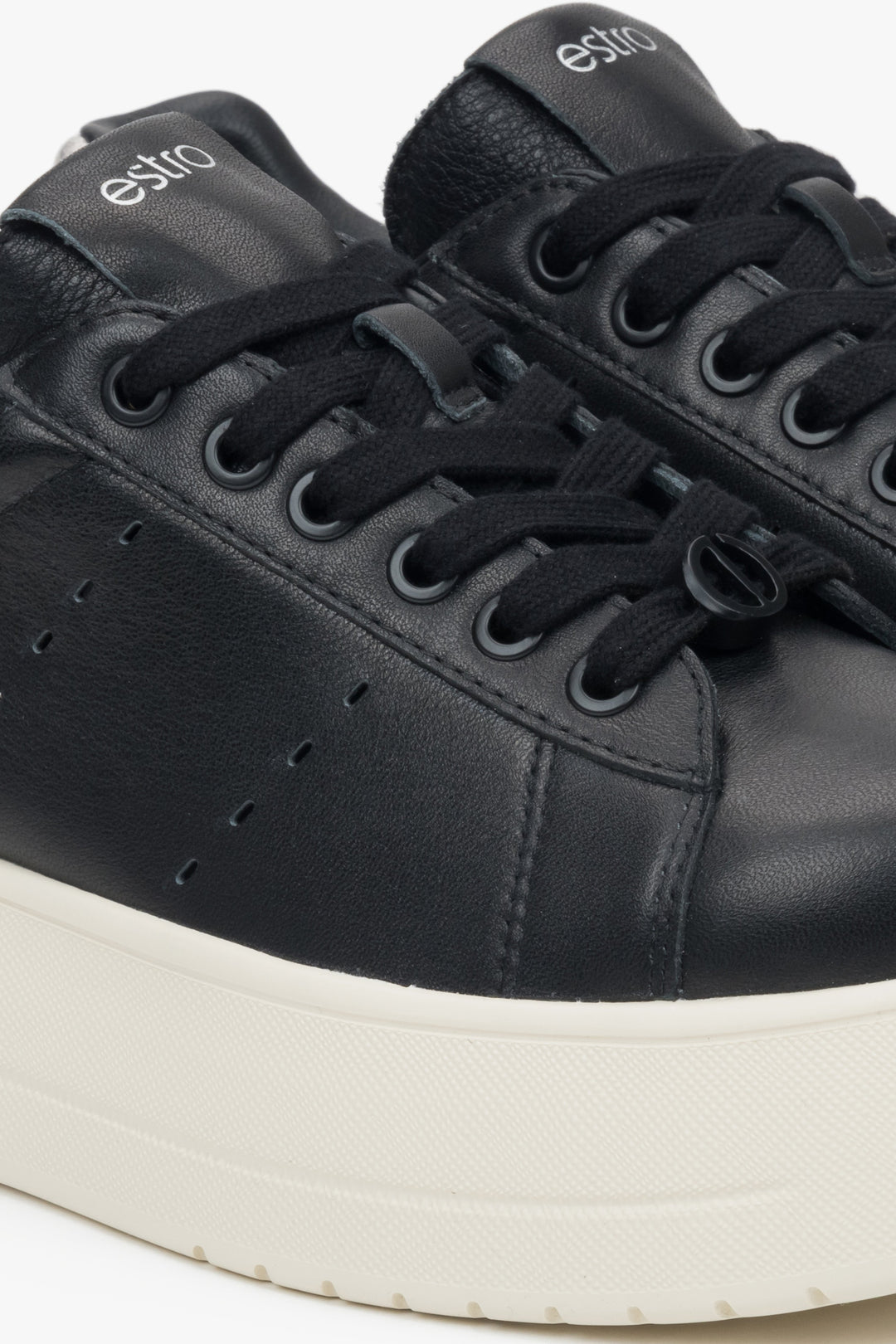 Estro black leather sneakers.