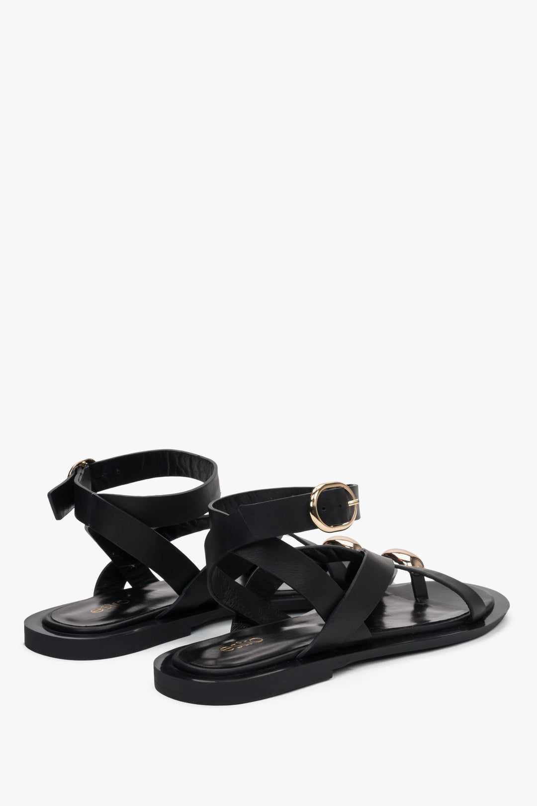 Classic black leather sandals for women, with strappy detailing and a subtle toe ring for added elegance.