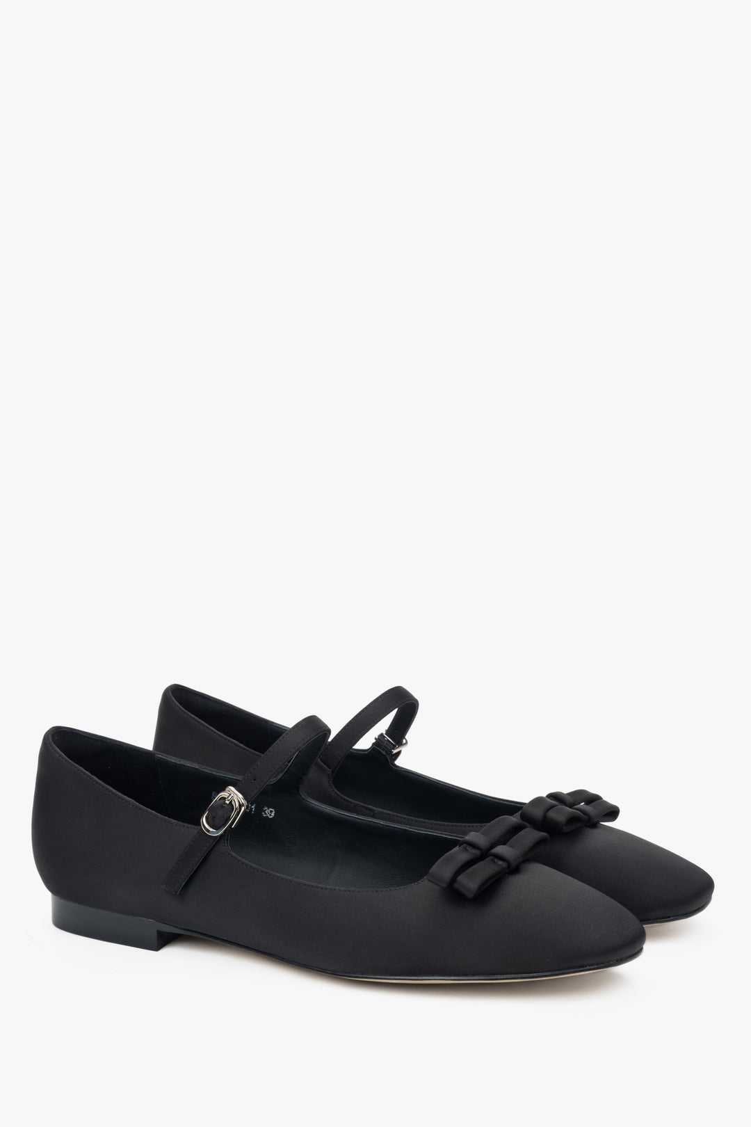 Black textile ballet flats with a buckle.