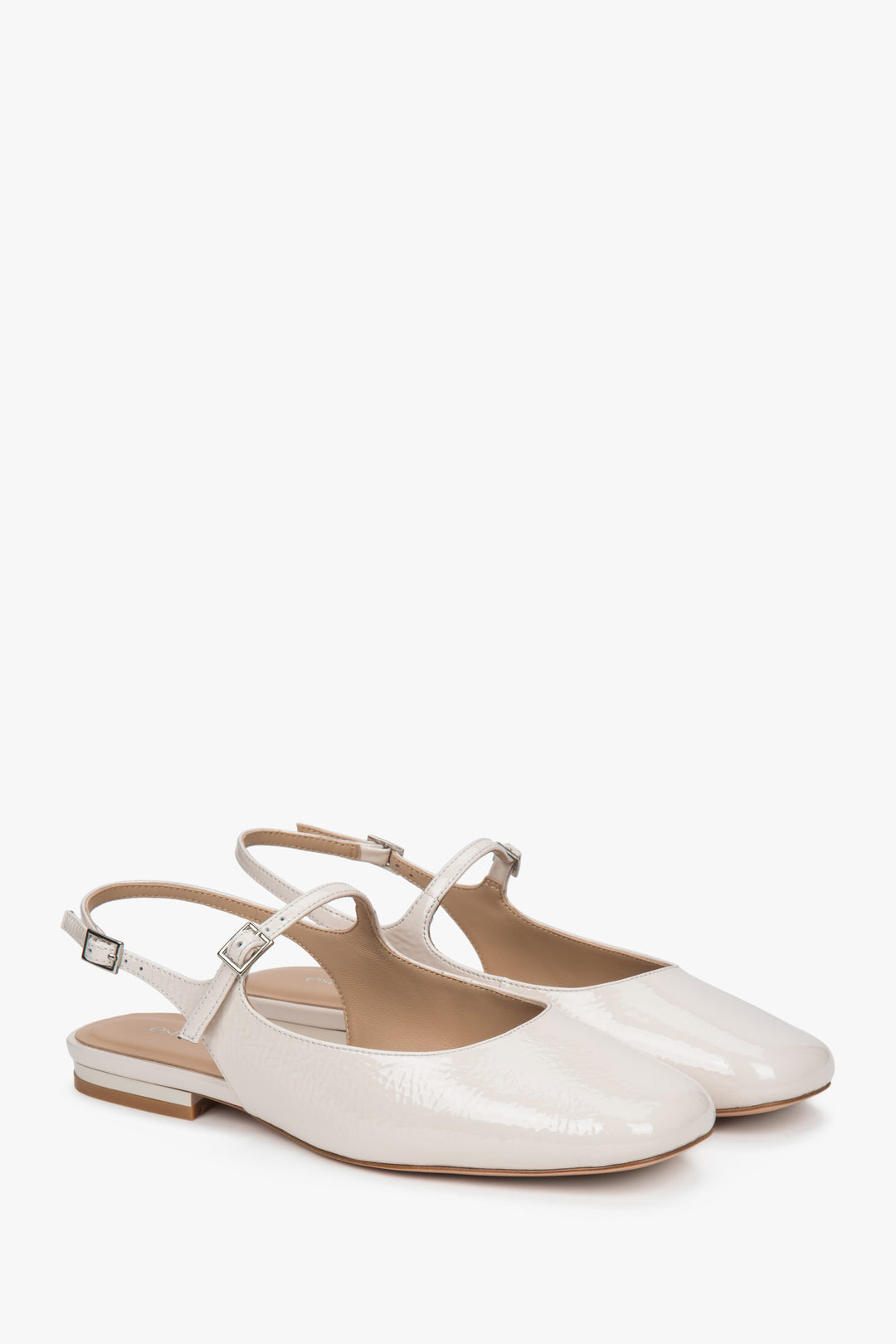Women's light beige patent leather slingback flats by Estro.