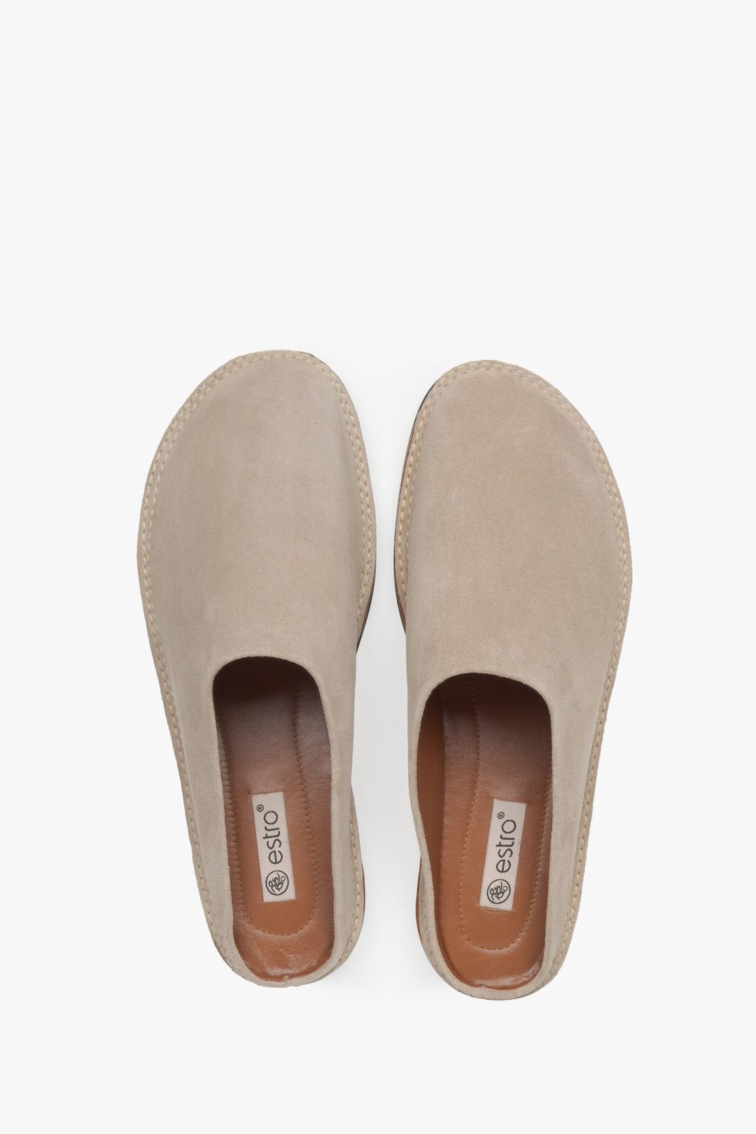 Light beige velour mules from Estro, offering a sophisticated and effortless look.