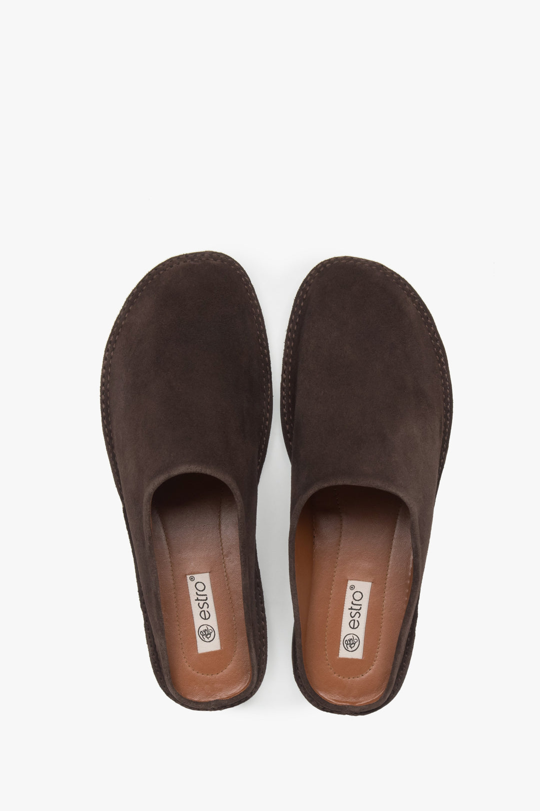 Saddle brown velour mules from Estro, offering a sophisticated and effortless look.