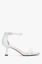 Elegant white sandals for women from Estro, crafted from genuine leather, and set upon a stylishly sturdy funnel heel.