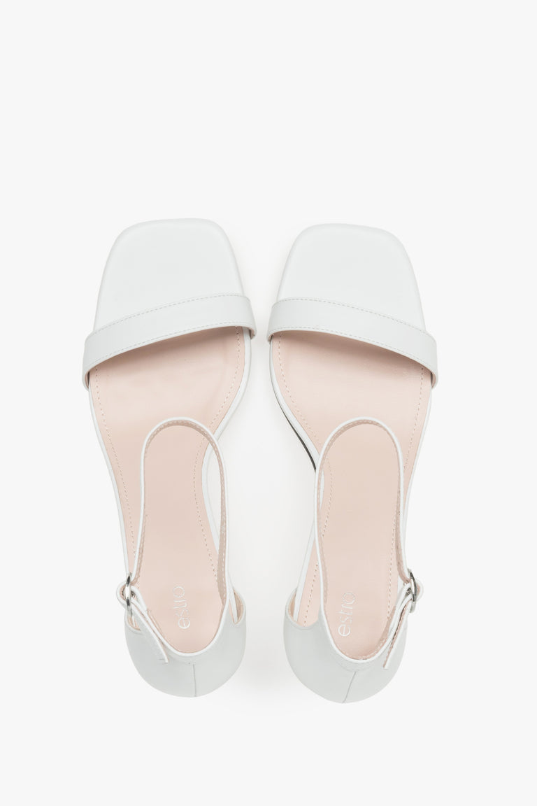 Sophisticated women's white sandals by Estro, crafted genuine leather, and finished with a modern funnel heel.