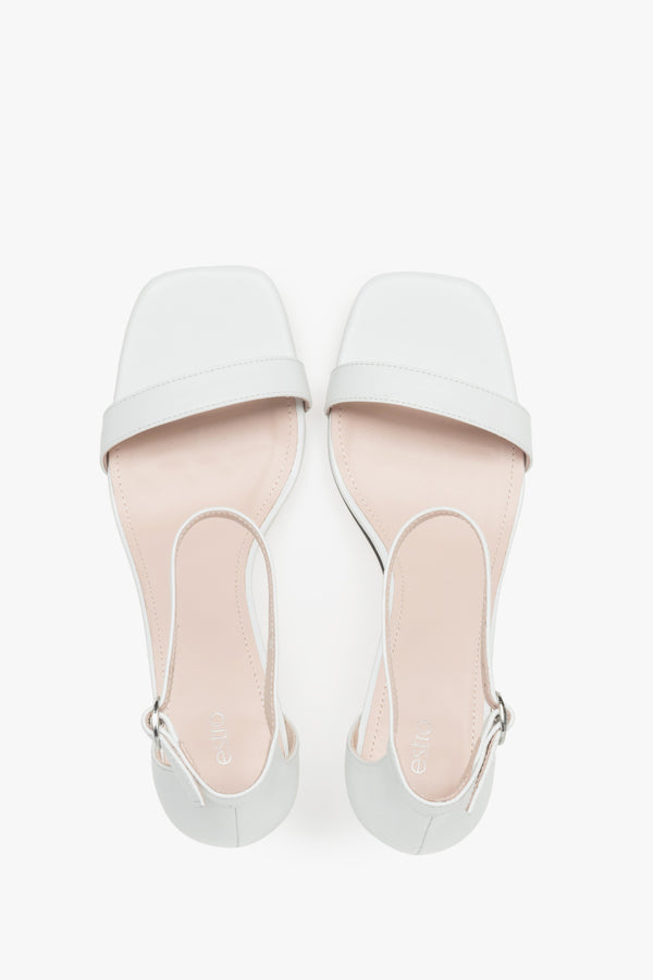 Sophisticated women's white sandals by Estro, crafted genuine leather, and finished with a modern funnel heel.