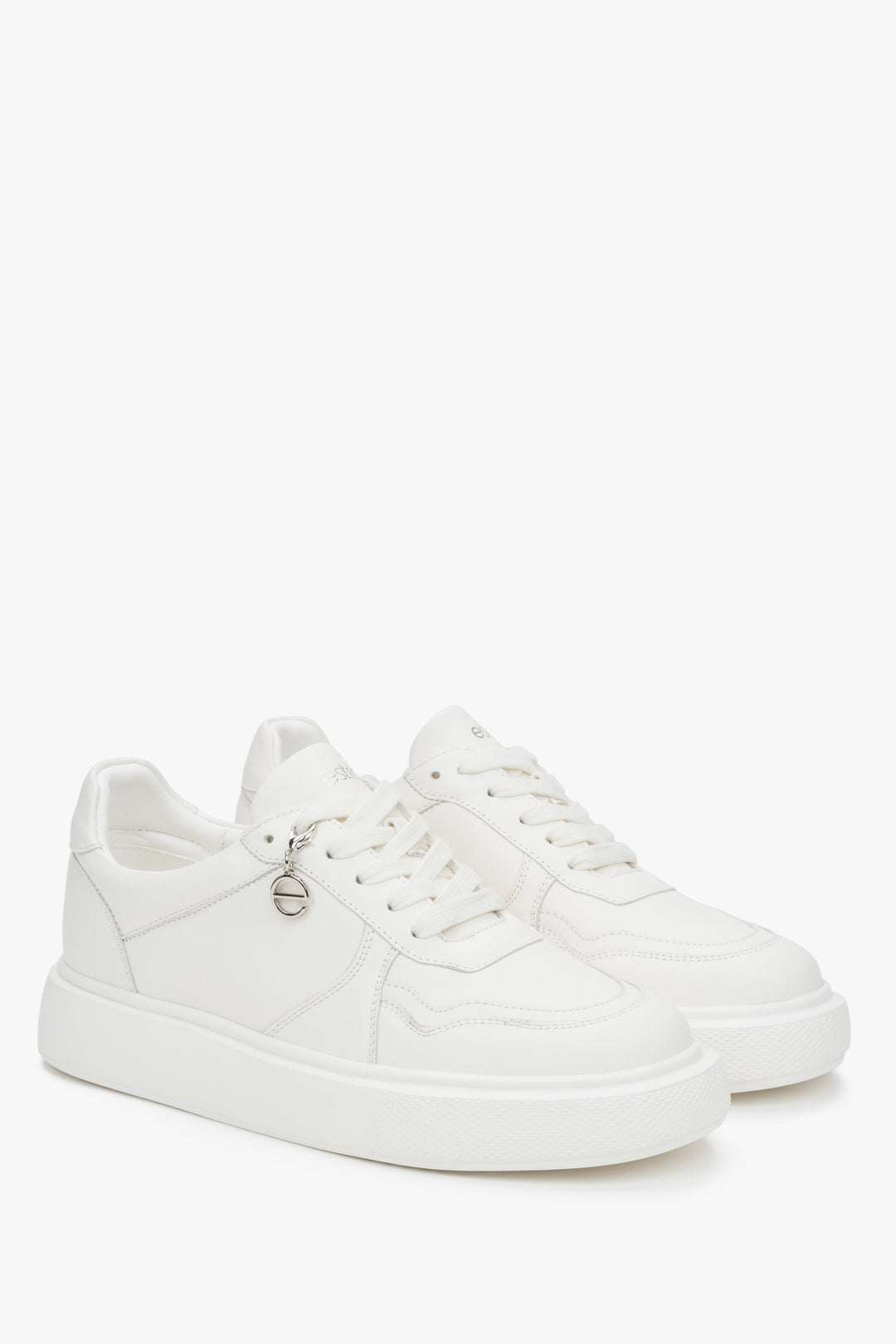 Stylish white Estro women's sneakers, made of natural leather and set on a flexible, comfortable sole.