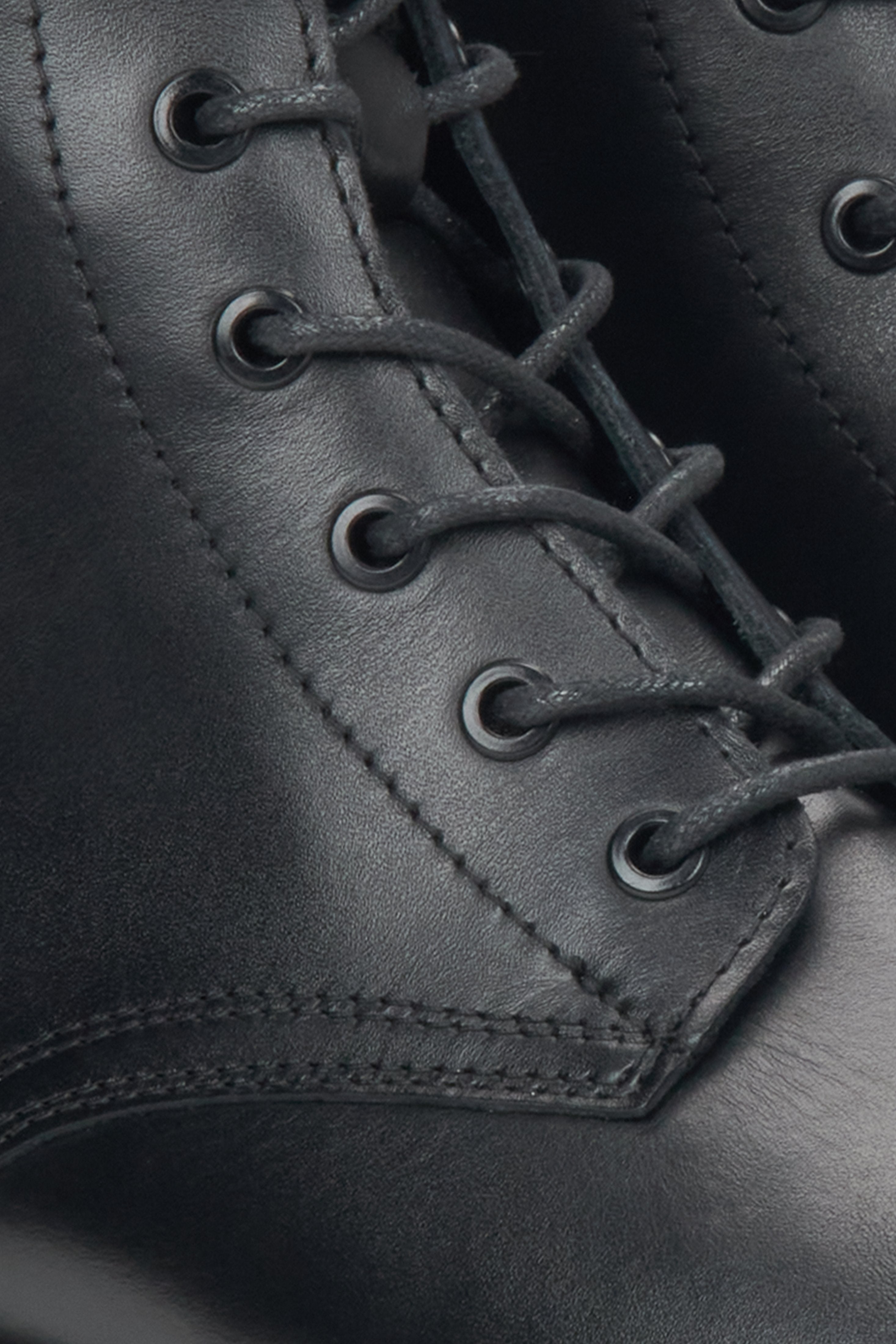 Women's black leather ankle boots by Estro - close-up of the details.