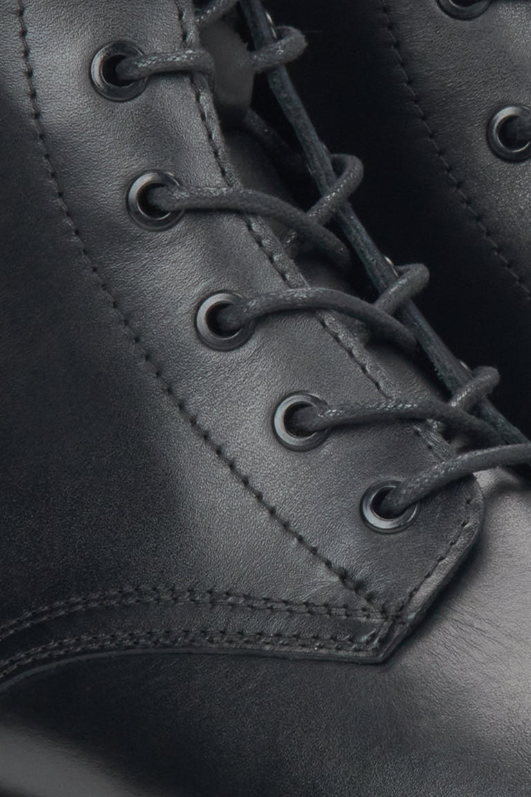 Women's black leather ankle boots by Estro - close-up of the details.