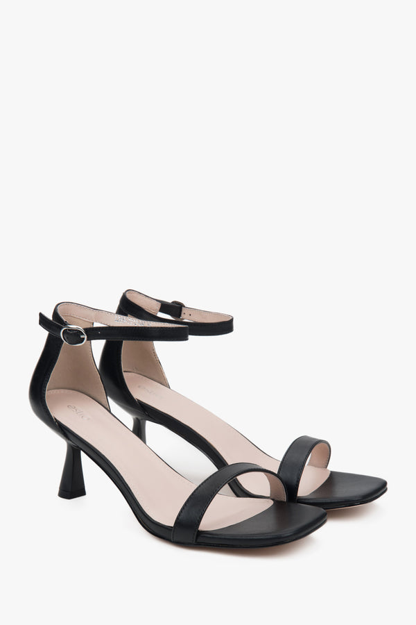 Black Estro women's sandals, made of genuine leather, set on a stylish and comfortable funnel heel.