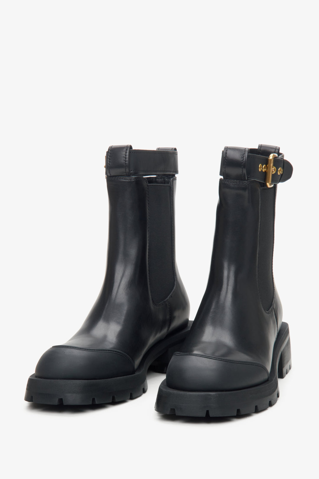 Black Chelsea boots made of genuine leather - presentation on a tip of the toe.
