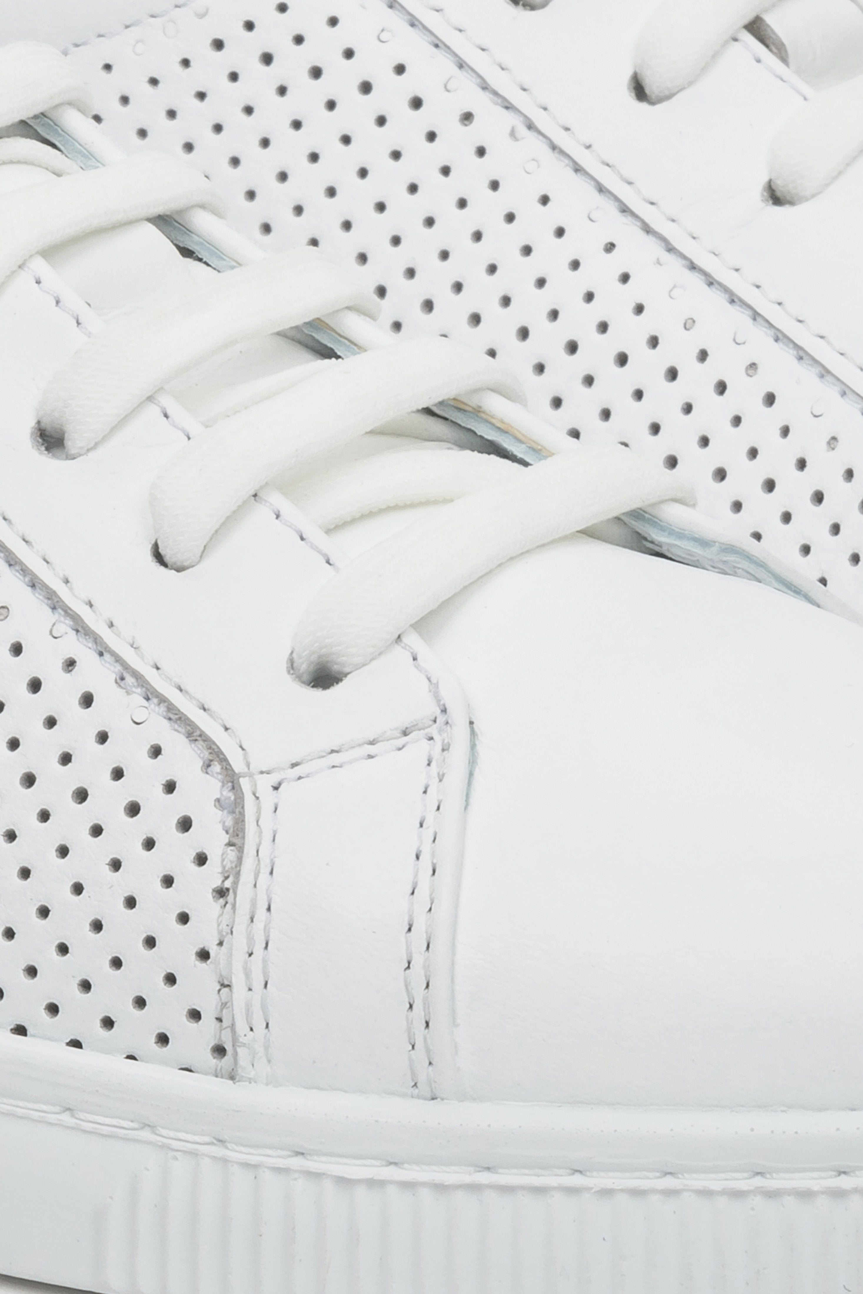 Women's white summer sneakers - close-up on the details.