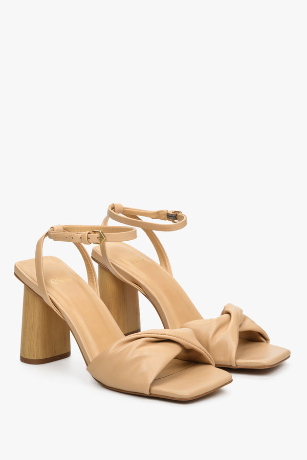 Women's beige leather sandals with a block heel by Estro.