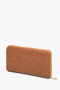 Large brown women's continental wallet with a zipper by Estro.