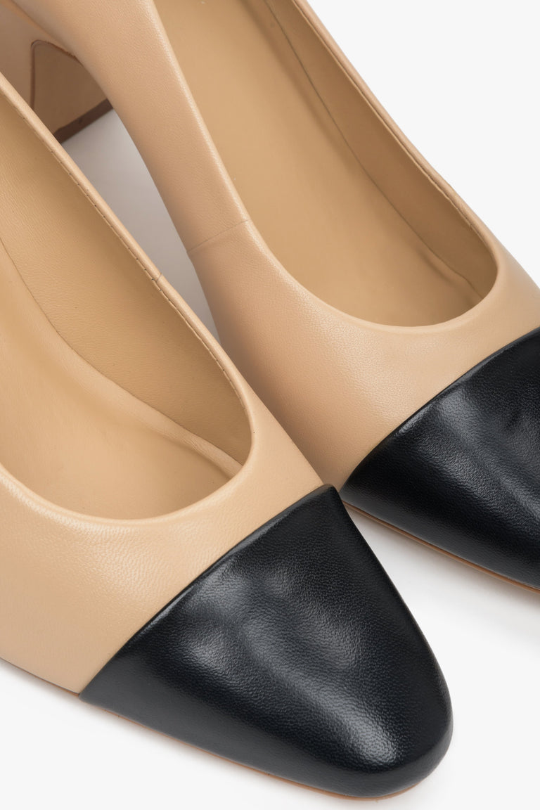 Women's beige and black leather pumps by Estro - close-up of the stitching line.