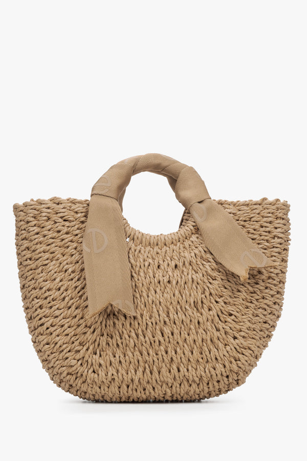 Estro women's woven purse with beige handle.